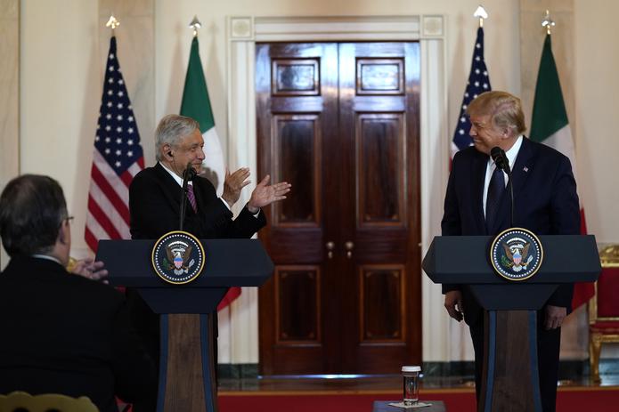 Mexican President Andres Manuel Lopez Obrador claps as President Donald Trump delivers a statement before a dinner at the White House, Wednesday, July 8, 2020, in Washington. (AP Photo/Evan Vucci)