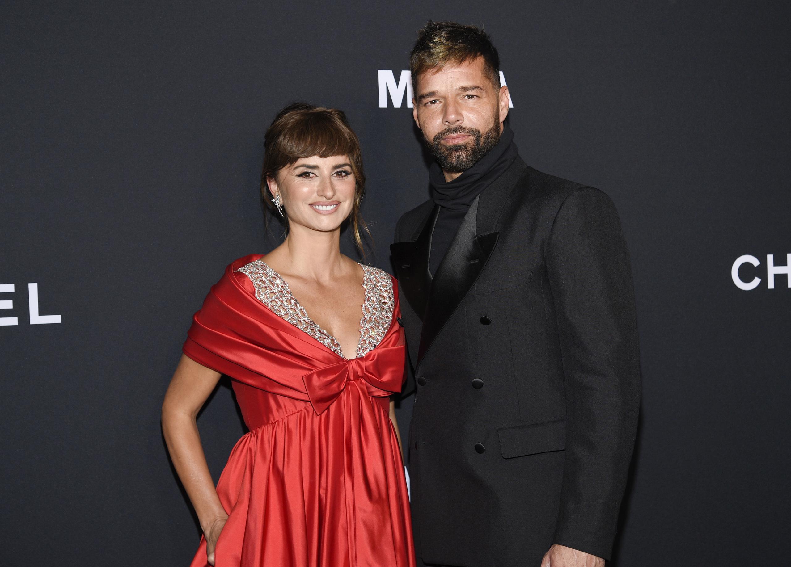 Penelope Cruz, left, and Ricky Martin attend the MoMA Film Benefit presented by CHANEL honoring Penelope Cruz at the Museum of Modern Art on Tuesday, Dec. 14, 2021, in New York. (Photo by Evan Agostini/Invision/AP)