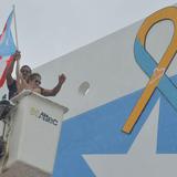 Colocan lazo en enorme mural con bandera por la población con Síndrome de Down