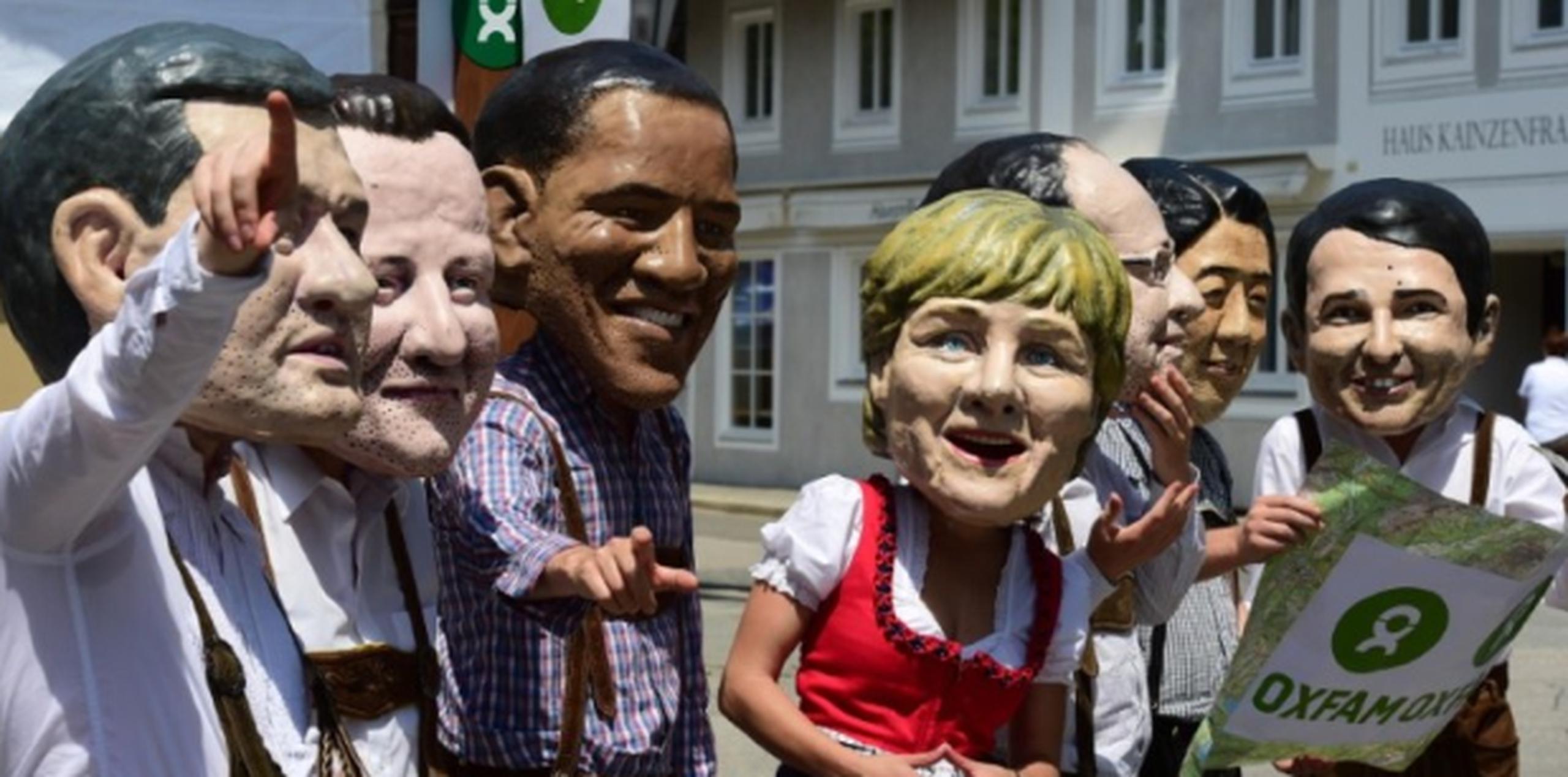 En la foto, protesta de integrantes de una organización sin fines de lucro, Oxfam, previo al encuentro del G7 en Alemania. (AFP)