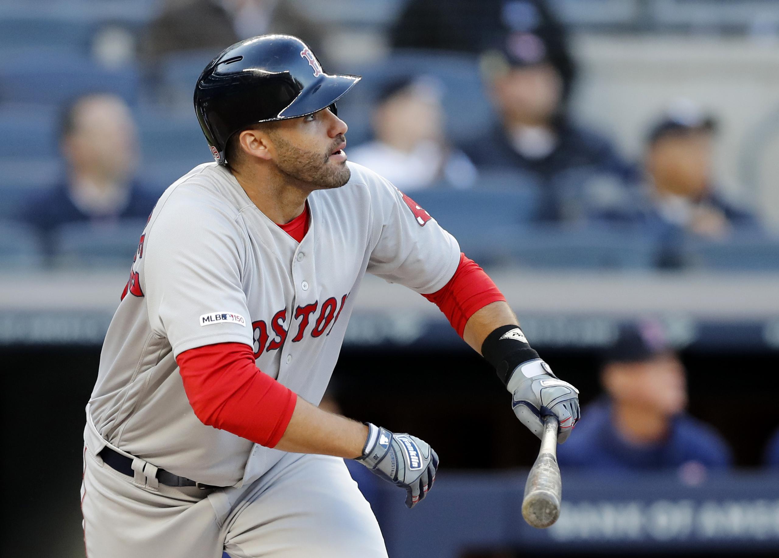 Boston Red Sox's J.D. Martinez watches his first-inning, solo home run off New York Yankees starting pitcher J.A. Happ during the first inning of a baseball game, Wednesday, April 17, 2019, in New York. (AP Photo/Kathy Willens)