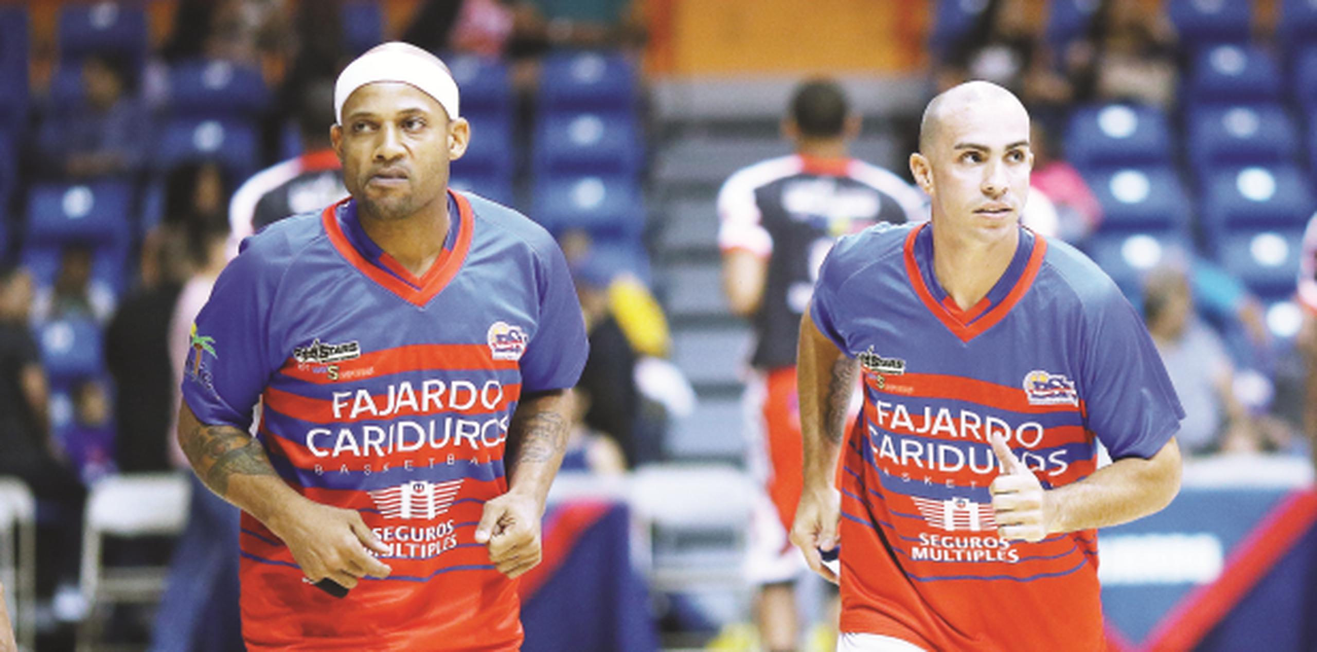 Larry Ayuso y Carlos Arroyo son de los canasteros locales que han podido dedicarse solo a jugar baloncesto en sus vidas. (jose.candelaria@gfrmedia.com)