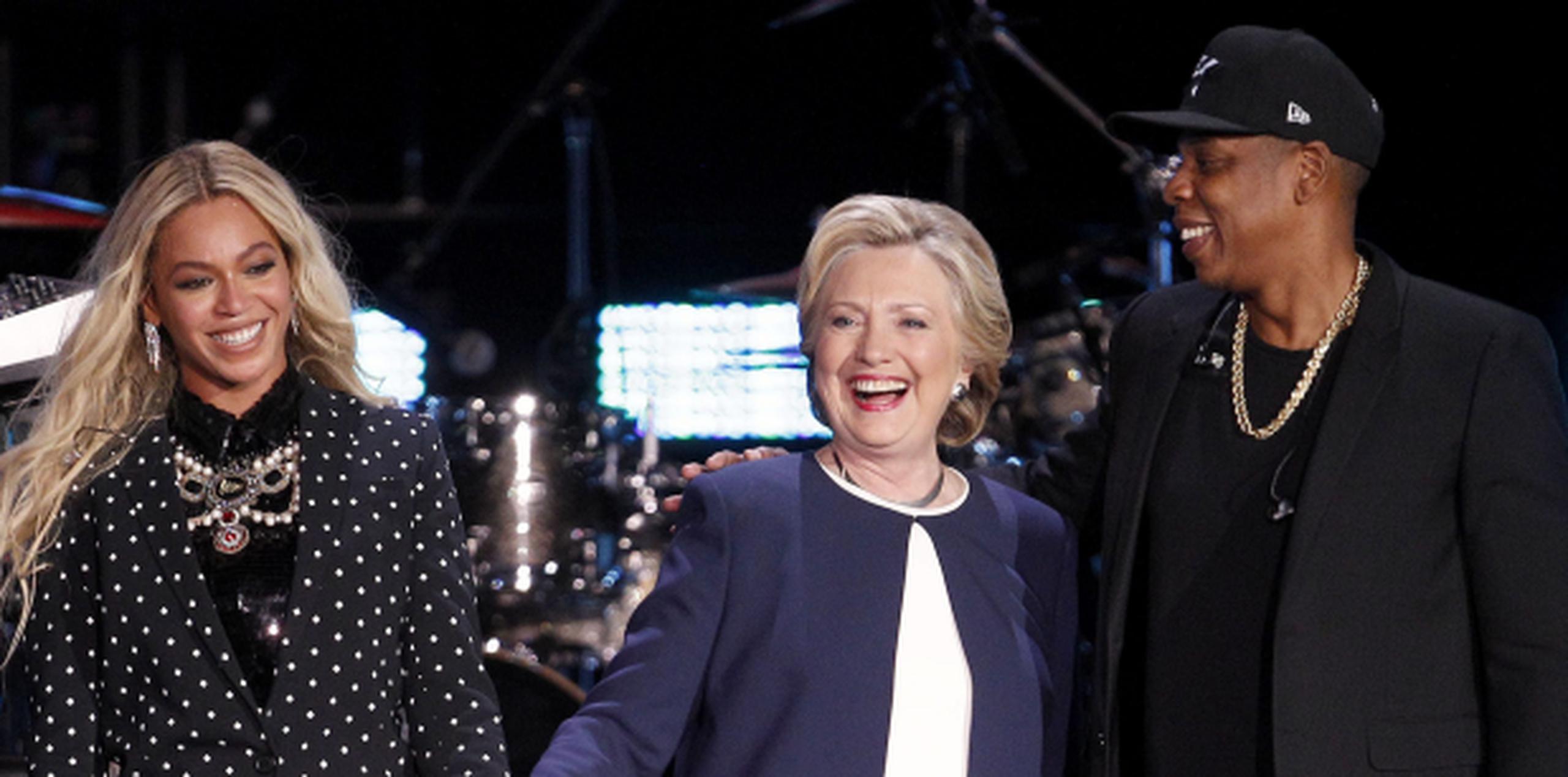 Beyoncé, Hillary Clinton y Jay Z. (EFE / David Maxwell)