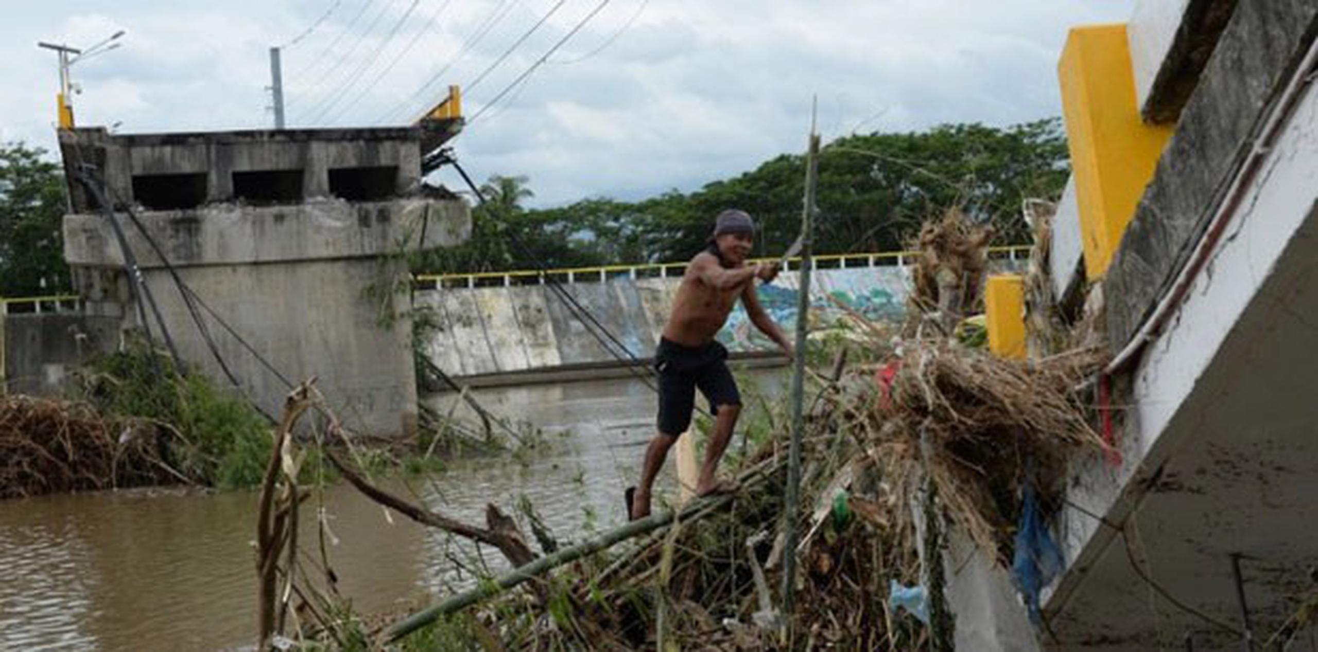 Del millón de personas afectadas por el tifón, más de la mitad acudió a los refugios de emergencia. (AFP PHOTO/TED ALJIBE)