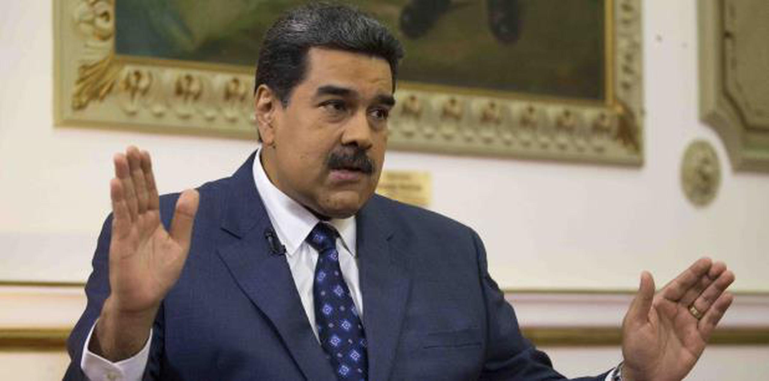 Maduro (AP Photo/Ariana Cubillos, File)
