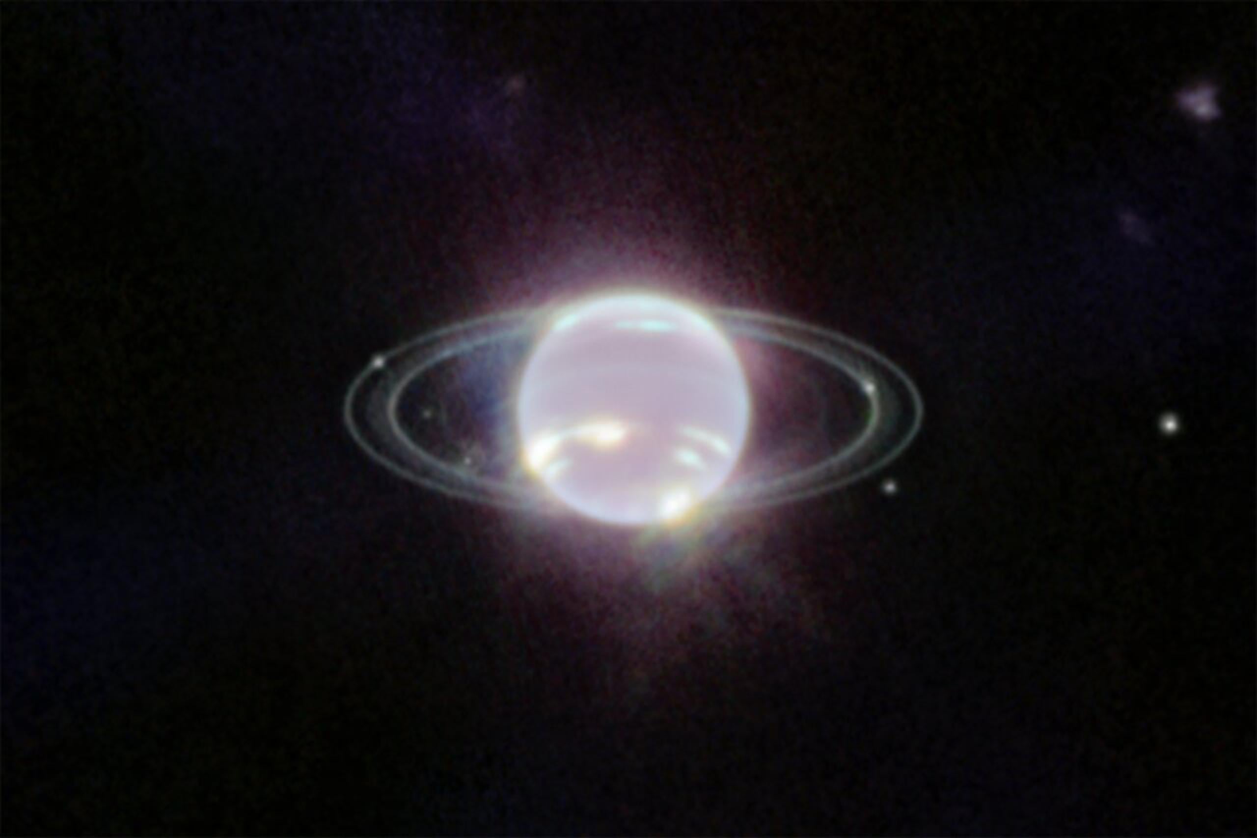 Imagen tomada por el telescopio espacial James Webb de siete de las lunas de Neptuno. El punto de luz más brillante a la izquierda es su satélite Tritón. EFE/NASA, ESA, CSA, and STScI.
