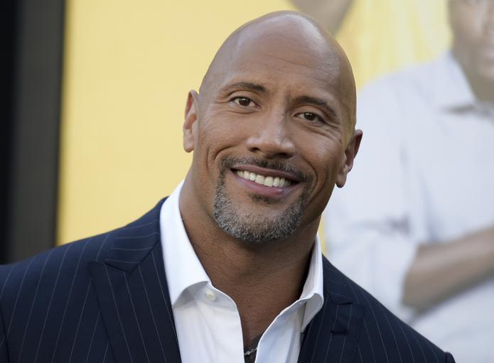 FILE - In this June 10, 2016 file photo, Dwayne Johnson attends the premiere of his film, "Central Intelligence" in Los Angeles. Johnson was named "Sexiest Man Alive" by People magazine on Nov. 15, 2016. (Photo by Richard Shotwell/Invision/AP, File)
