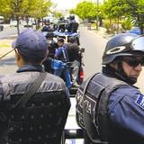 Detienen a 12 policías acusados de matar a 19 en México