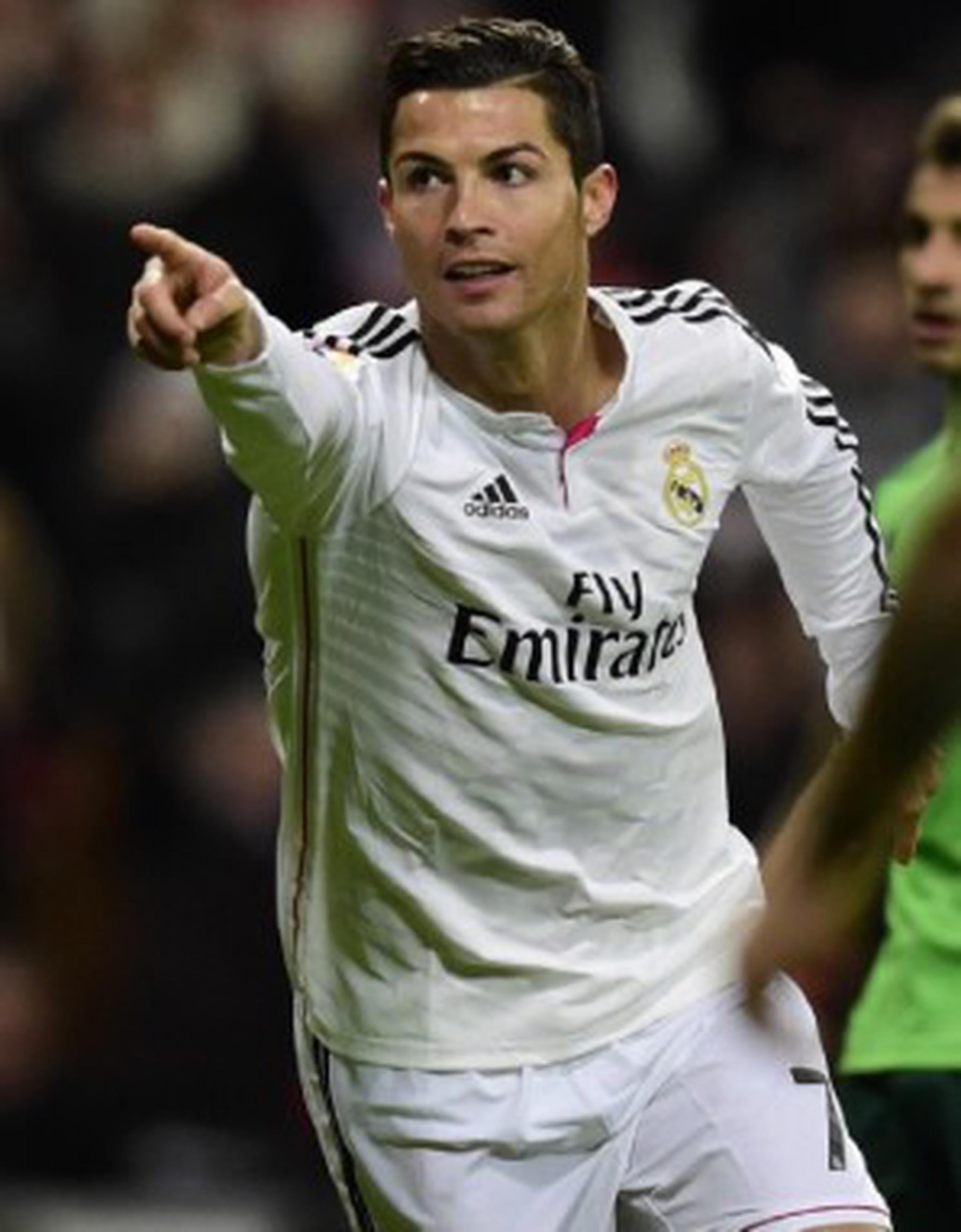 Cristiano Ronaldo celebra luego de anotar su tercer gol del partido contra Celta de Vigo. (AFP / Javier Soriano)