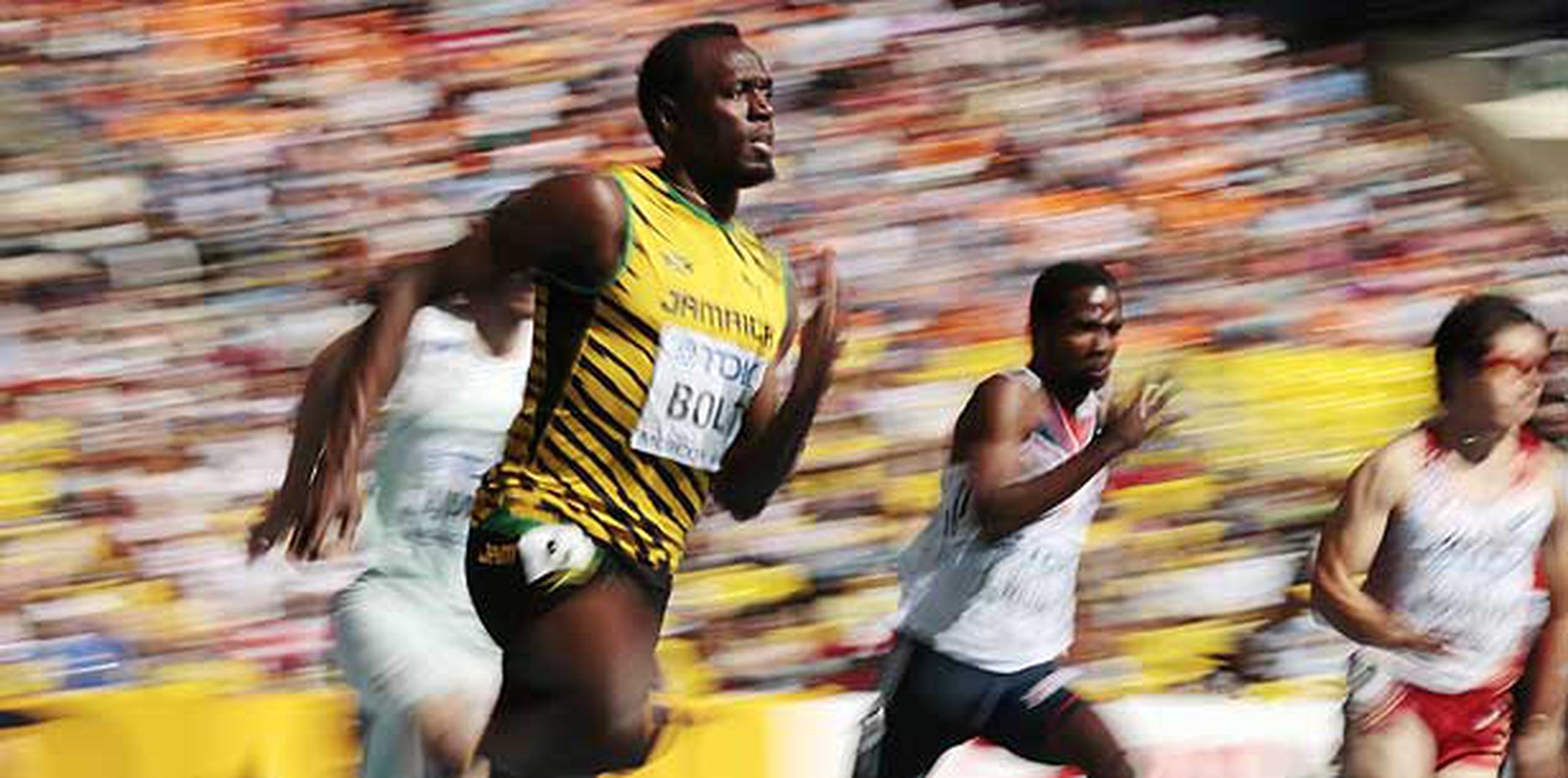 "Estoy bien, nada más que soy perezoso por las mañanas", dijo Usain Bolt al terminar de correr. (AP /Iván Sekretarev)