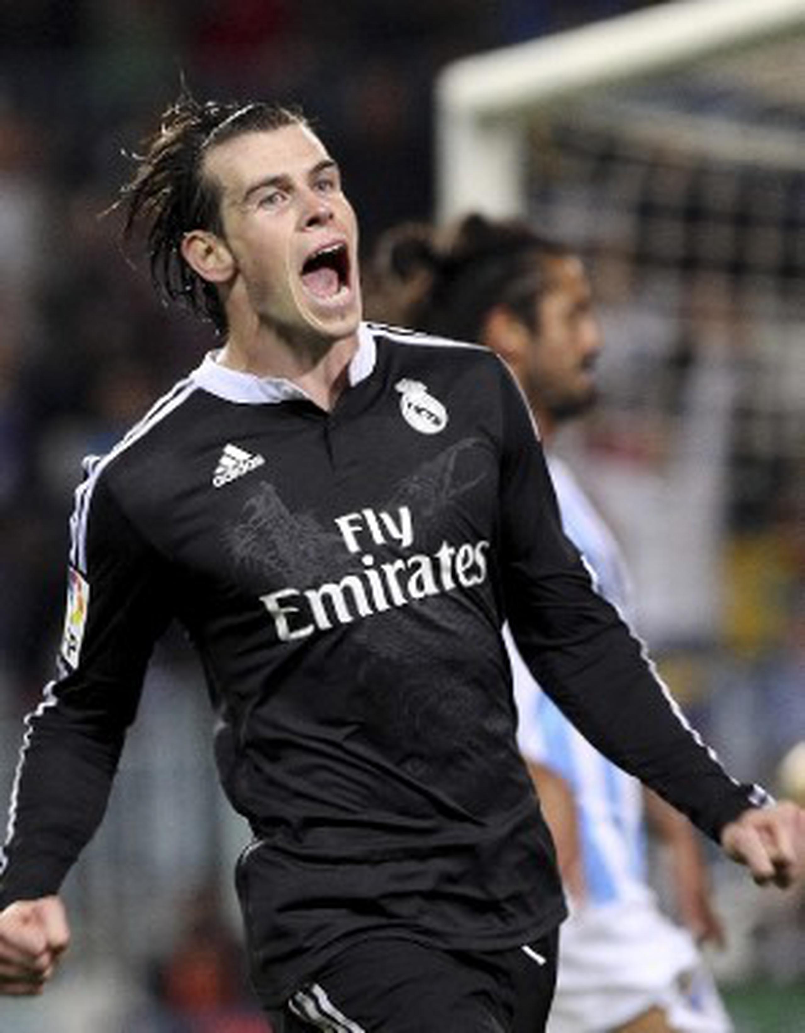 Gareth Bale celebra el gol que consiguió en el triunfo del Real Madrid sobre Málaga. (EFE / Daniel Pérez)
