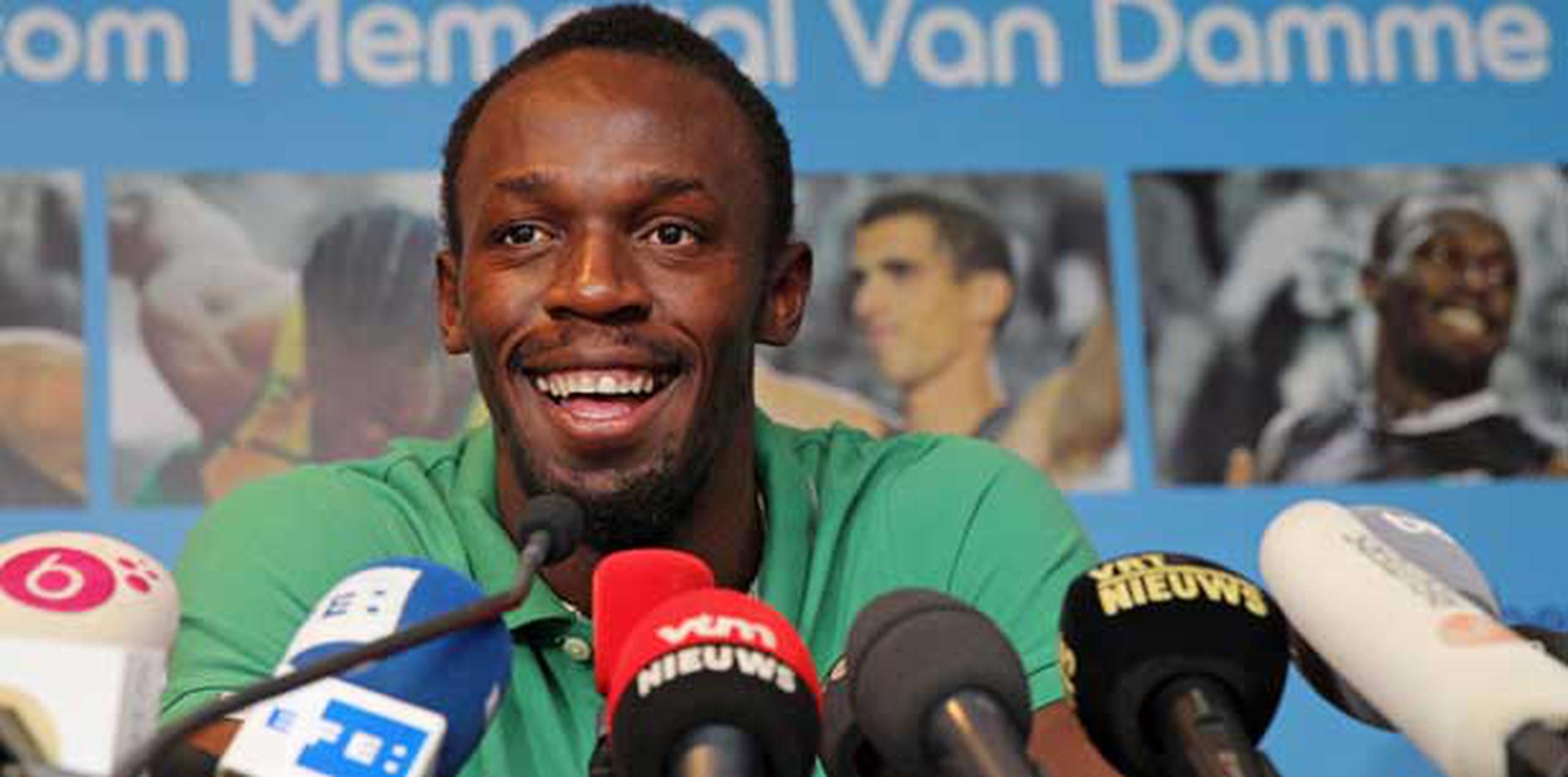 "Si quiero estar entre los grandes como (Muhammad) Alí y Pelé y todos esos, tengo que seguir dominando hasta que me retire", afirmó Usain Bolt.  (AP/Yves Logghe)