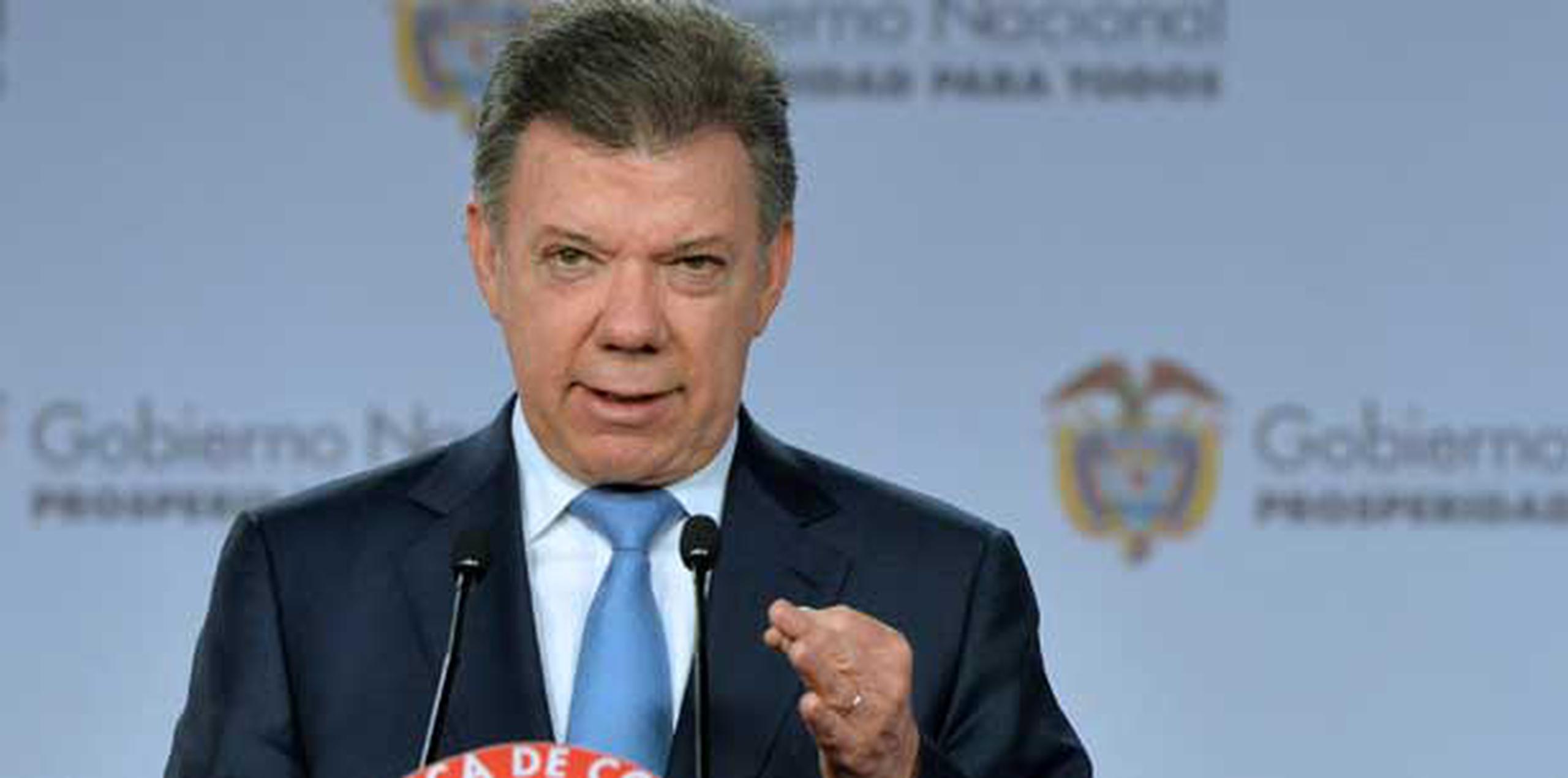 El presidente Juan Manuel Santos busca la reelección en los comicios del 25 de mayo.  (Archivo)