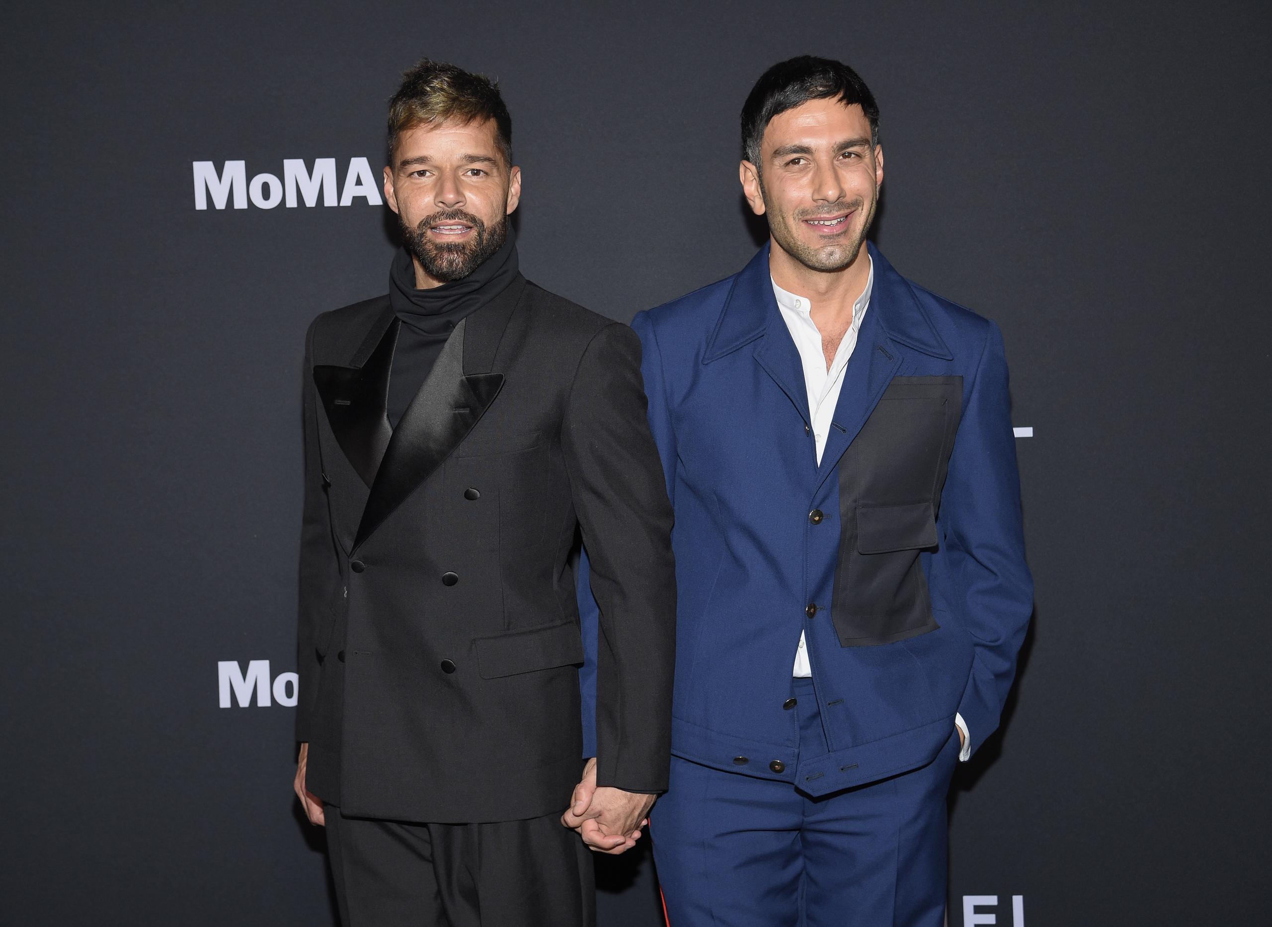 Ricky Martin, left, and husband Jwan Yosef attend the MoMA Film Benefit presented by CHANEL honoring Penelope Cruz at the Museum of Modern Art on Tuesday, Dec. 14, 2021, in New York. (Photo by Evan Agostini/Invision/AP)