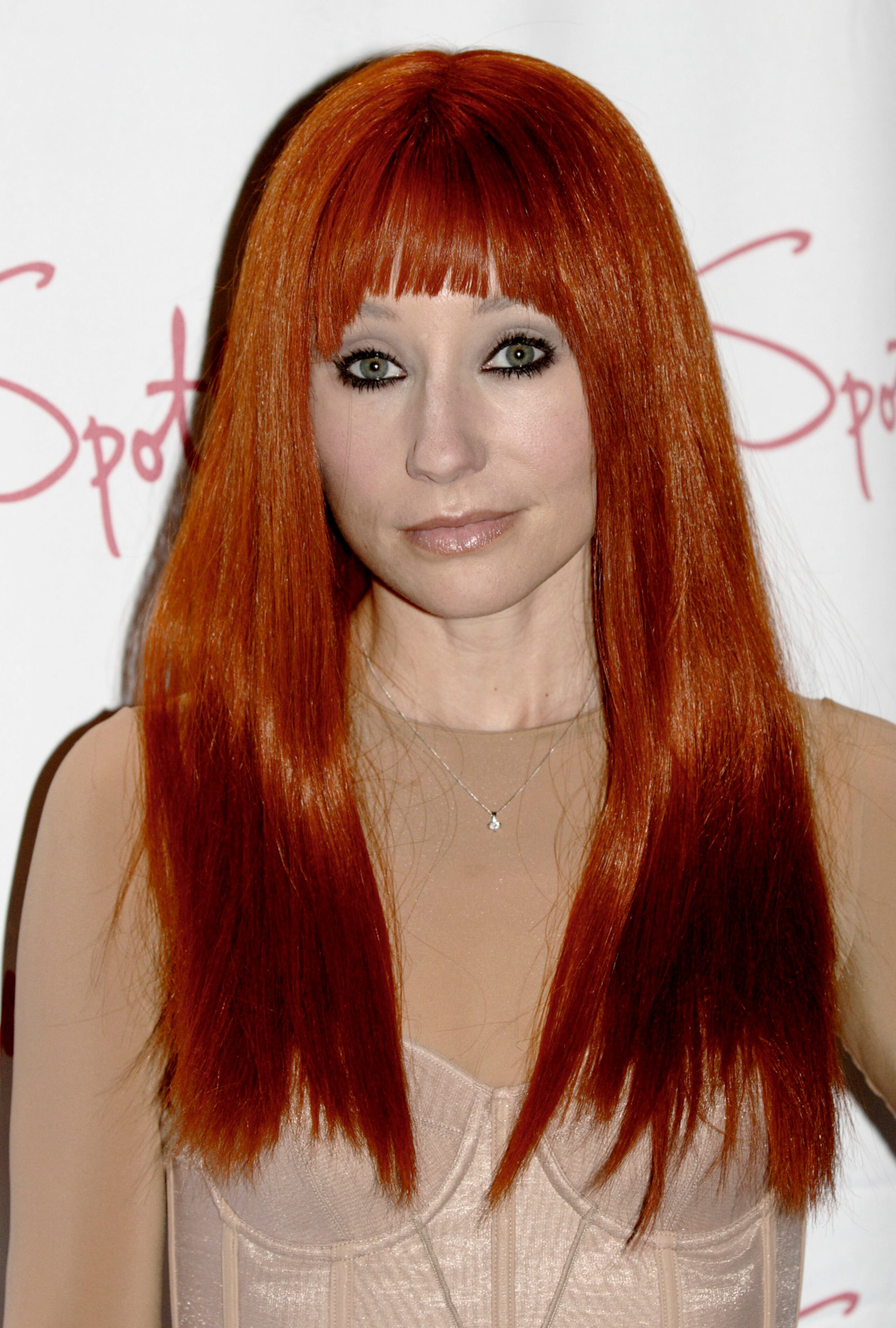 Tori Amos poses for photographers during her album release party held at Spotlight Live in New York on Tuesday, May 1, 2007. Amos performed a selection of songs from her new album "American Doll Posse". (AP Photo/Adam Rountree)