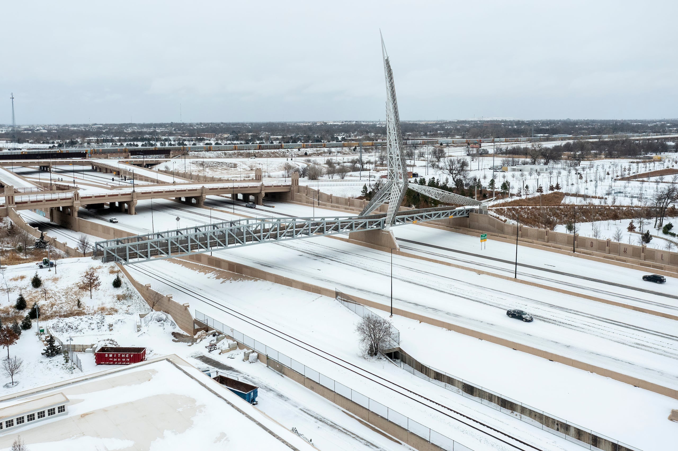An aerial view snow covered Interstate 40 near downtown Oklahoma City on Saturday, Jan. 24, 2026. (AP Photo/Alonzo Adams)