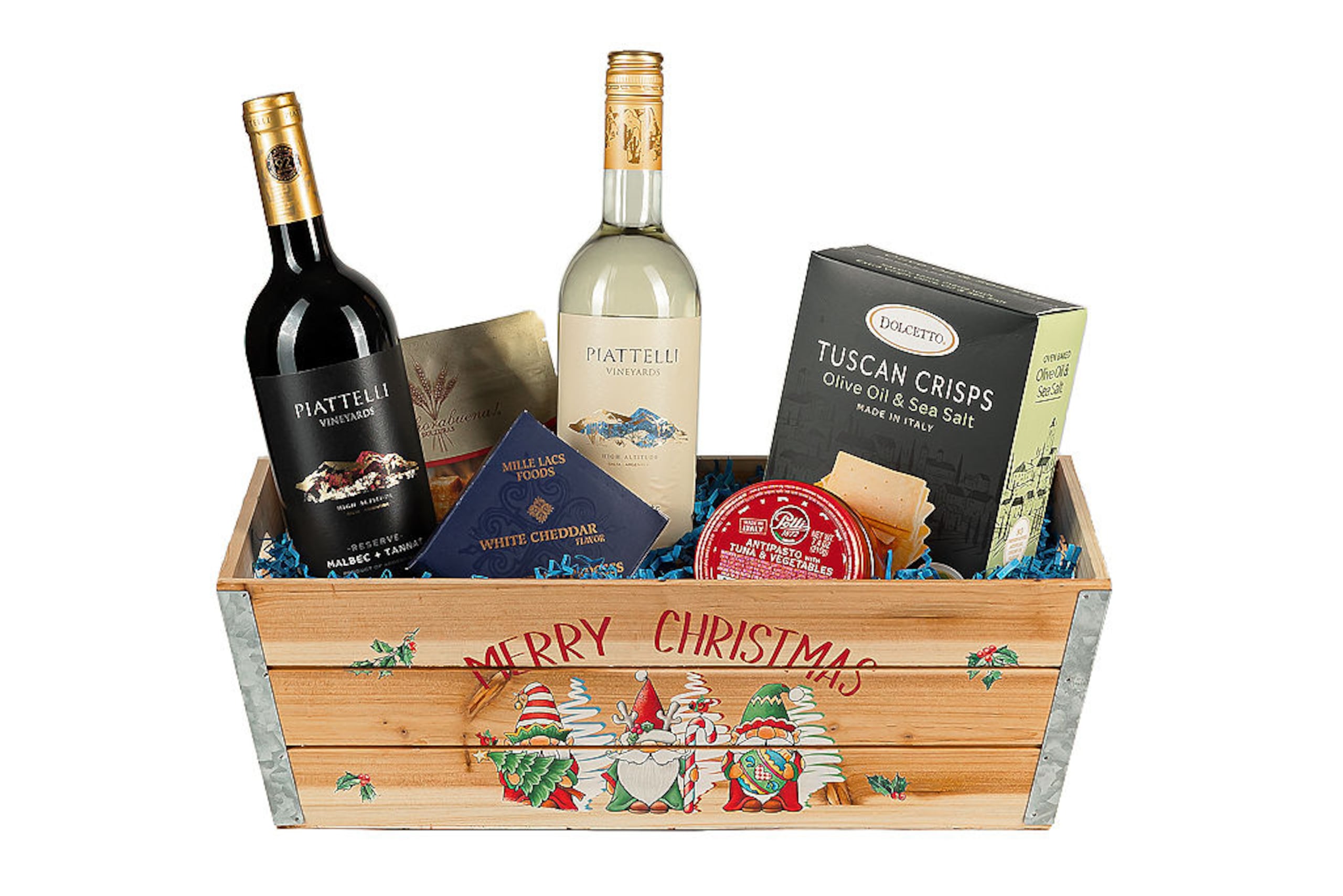 Curiosa canasta con motivo navideño que incluye vinos argentinos Piatelli Malbec Tannat, Piatelli Reserva Torrontés y conserva.