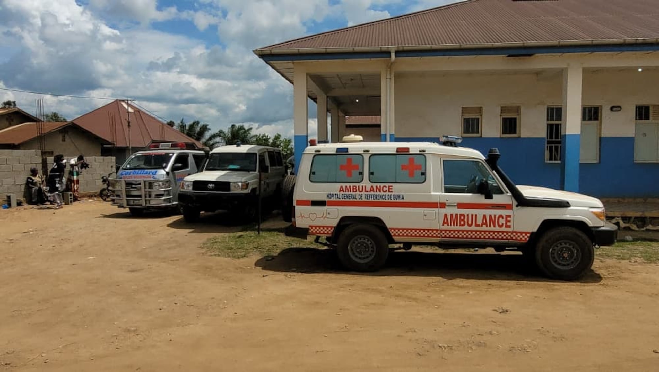 Ambulances are parked outside a hospital in Bunia, Congo, Saturday, May 16, 2026. (AP Photo/Constant Same Bagalwa)