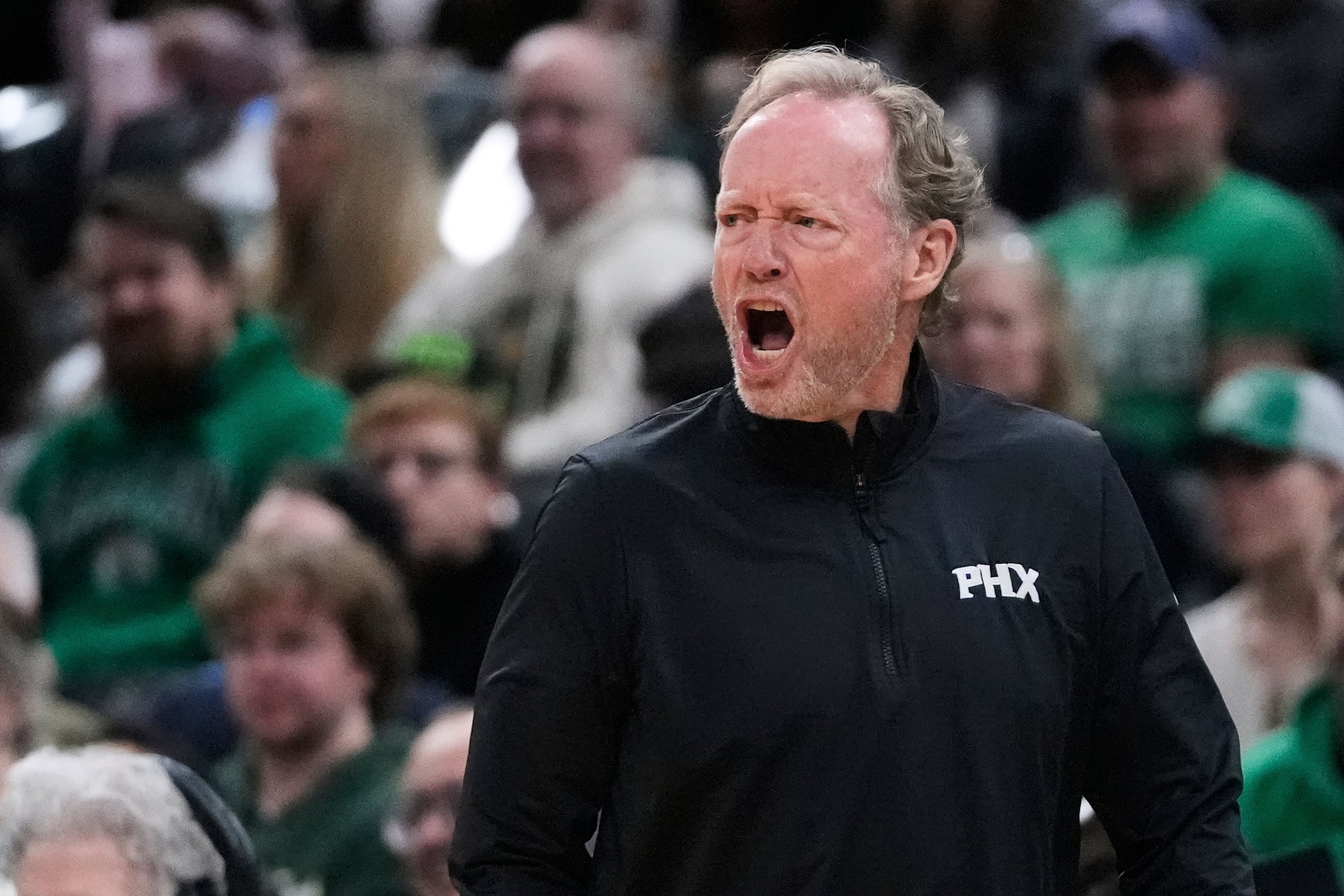 Phoenix Suns head coach Mike Budenholzer calls to his players during the first half of an NBA basketball game against the Phoenix Suns, Friday, April 4, 2025, in Boston. (AP Photo/Charles Krupa)