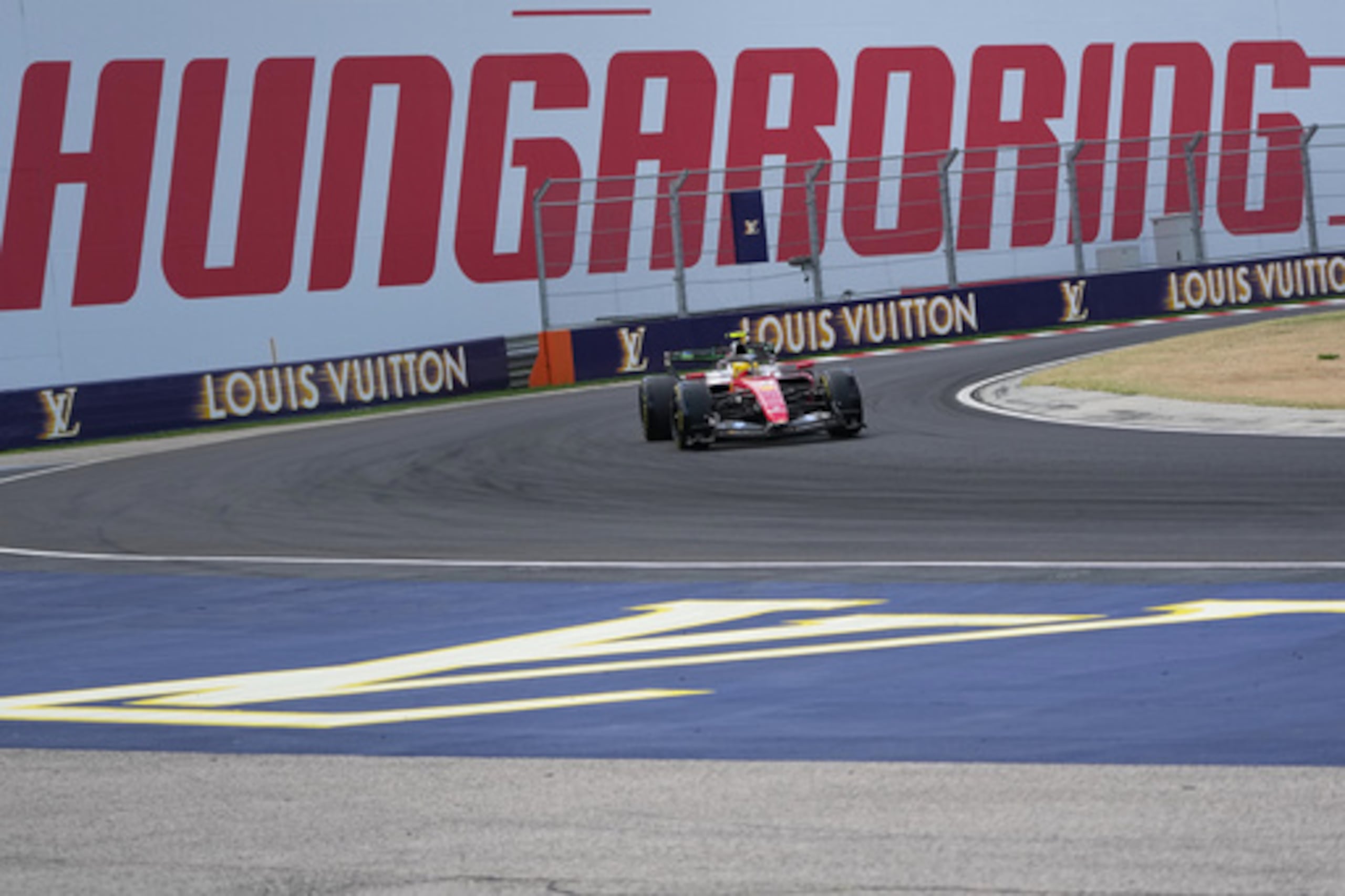 Britain's Lewis Hamilton steers his Ferrari during the first practice session ahead of Sunday's Formula One Hungarian Grand Prix auto race, at the Hungaroring racetrack in Mogyorod, near Budapest, Hungary, Friday, July 24, 2026. (AP Photo/Darko Vojinovic)