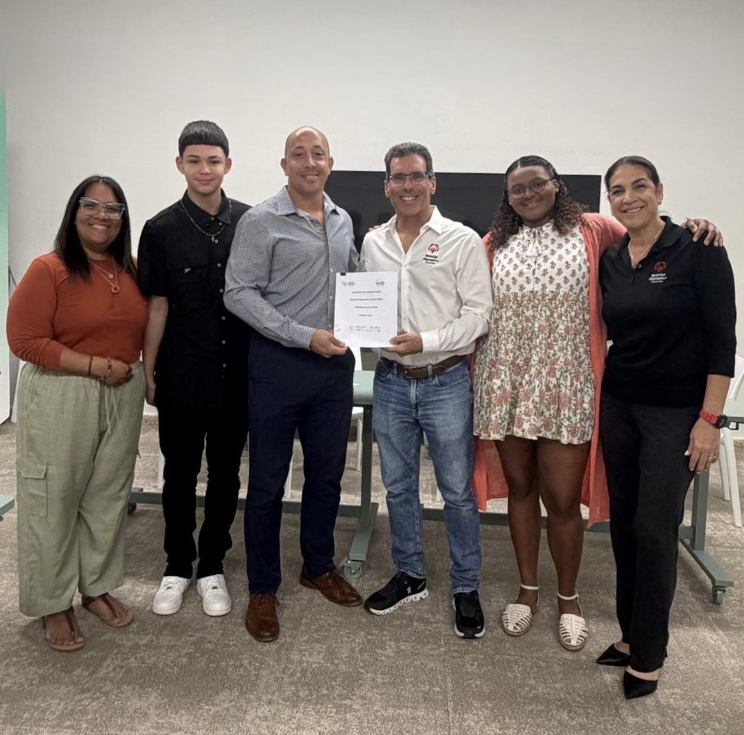 FIrma de la alianza entre SOPR y Virtus.