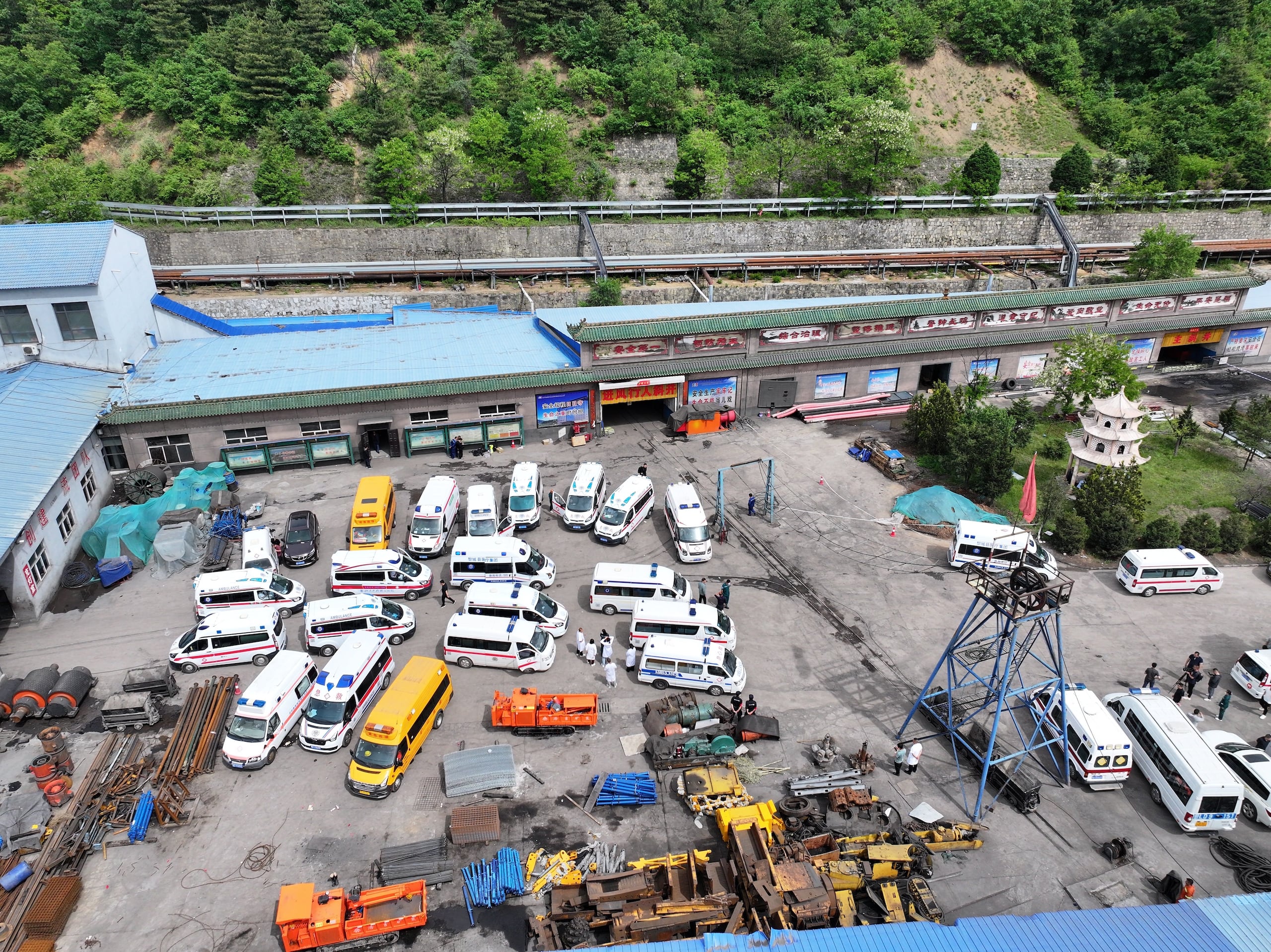 (260523) -- QINYUAN, May 23, 2026 (Xinhua) -- An aerial drone photo taken on May 23, 2026 shows a scene at the rescue site of the Liushenyu coal mine in Qinyuan County, north China's Shanxi Province. The coal mine accident in north China's Shanxi Province has left 82 people dead, with nine others still unaccounted for, according to the county's emergency management bureau.
The gas explosion occurred on Friday at the Liushenyu coal mine in Qinyuan County. The province has sent 755 people including rescuers and medical personnel to the site. Rescue efforts are ongoing. (Photo by Bai Zhibin/Xinhua) (Photo by Bai Zhibin / Xinhua via AFP)