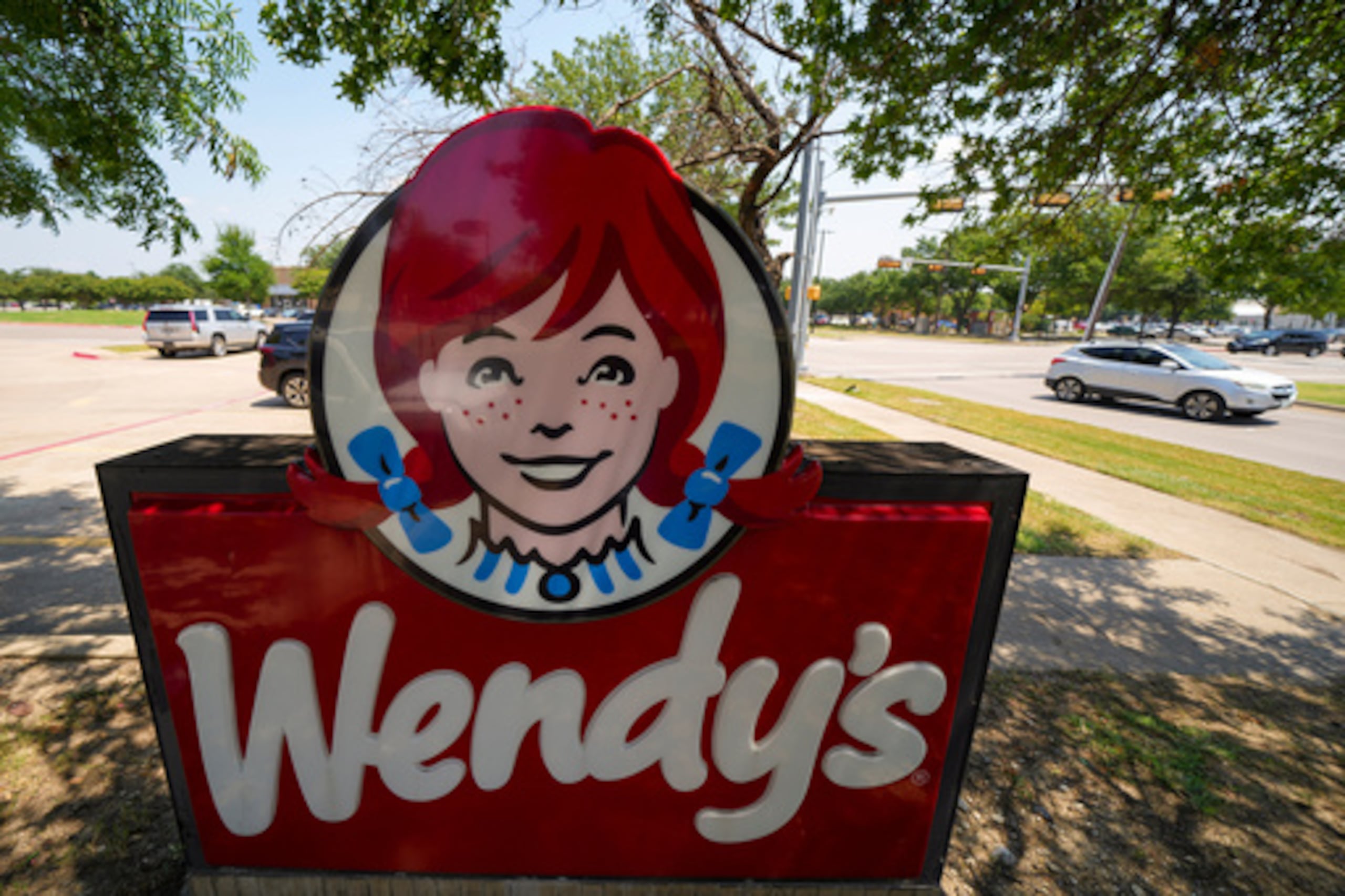 FILE - A sign is seen at a Wendy's restaurant Tuesday, Aug. 5, 2025, in Garland, Texas. (AP Photo/Julio Cortez, File)