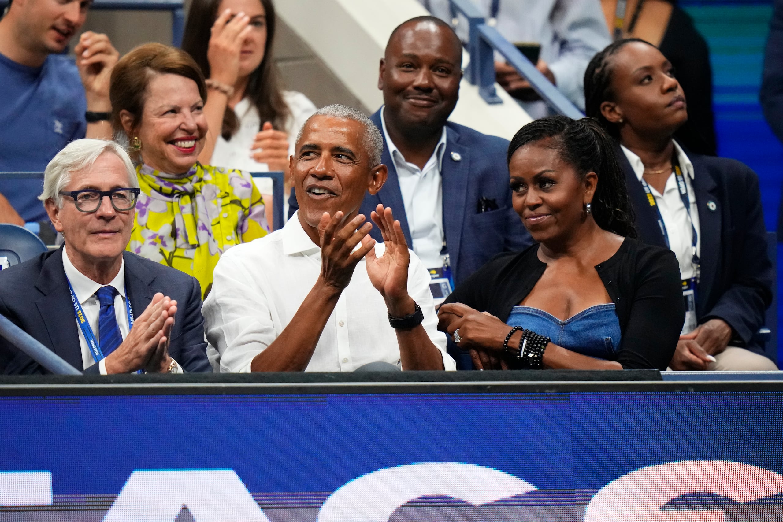 El expresidente de los Estados Unidos Barack Obama y su esposa Michelle durante un partido del US Open.