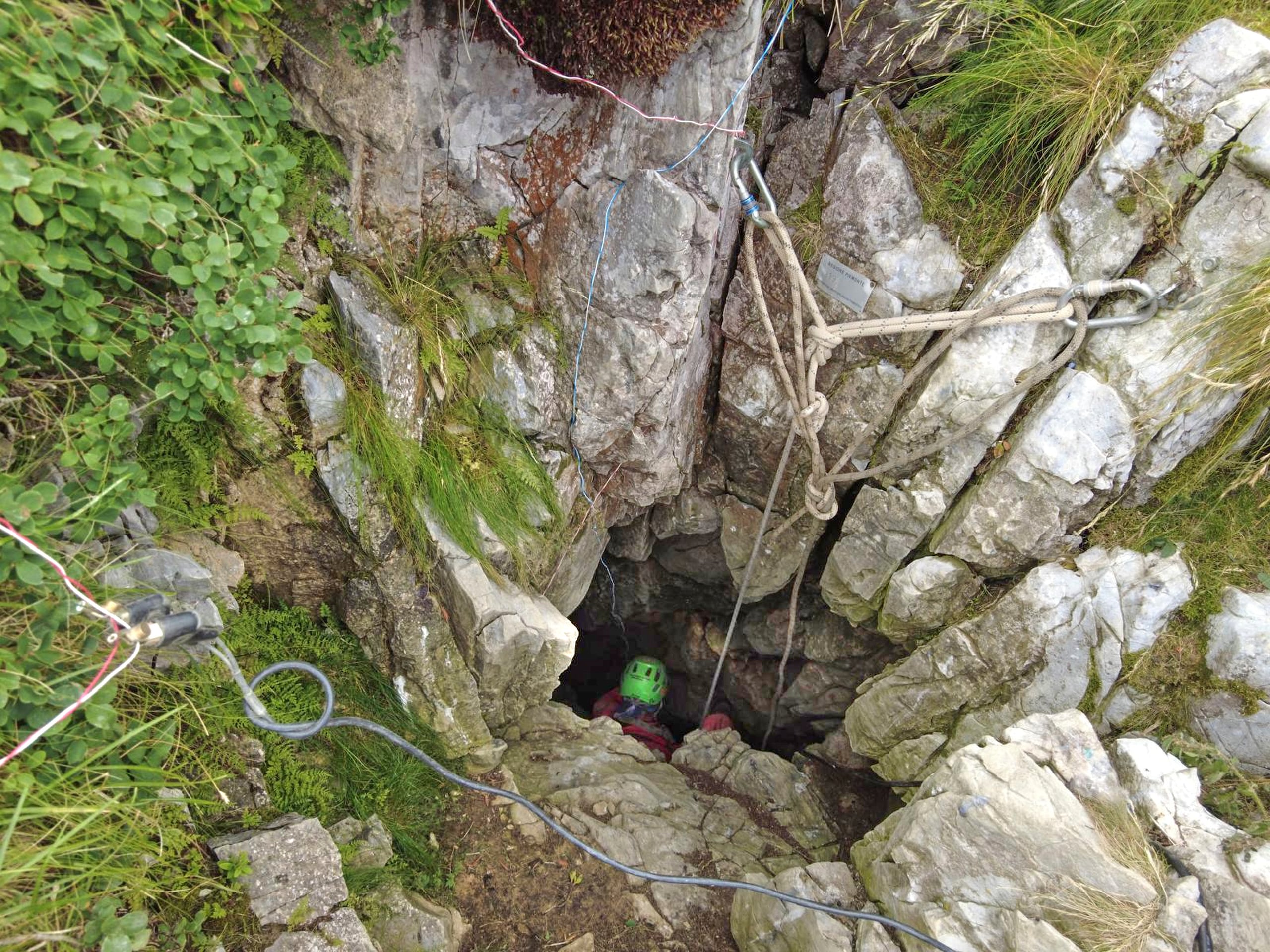 This photo, provided on Monday, July 21, 2025, by the Italian National Alpine and Speleological Rescue Corps, shows rescue operations outside the cave where a 62-year-old speleologist became trapped on Sunday. (National Alpine and Speleological Rescue Corps via AP)