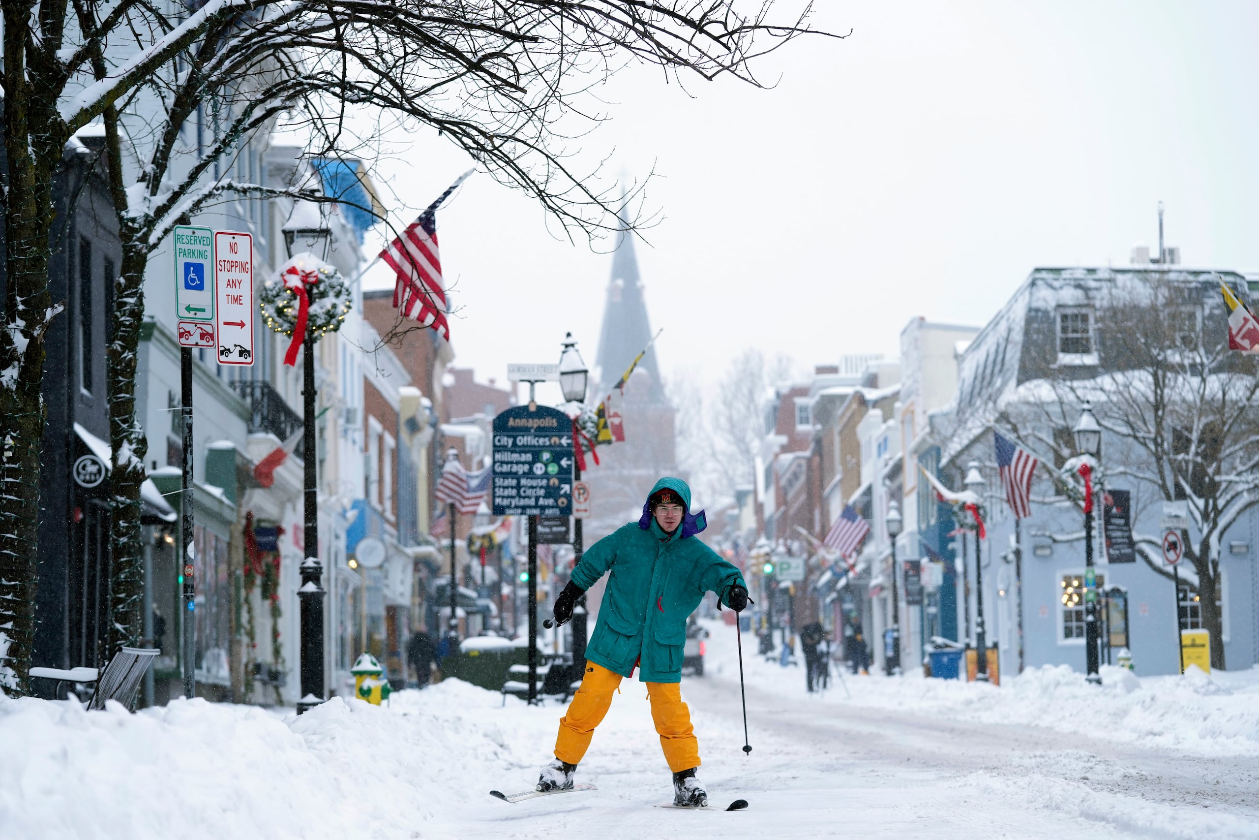 Cosimos Cendo, of Washington, D.C., skis down Main Street in Annapolis, Md., Monday, Jan. 6, 2025, during a snow storm. (AP Photo/Susan Walsh)