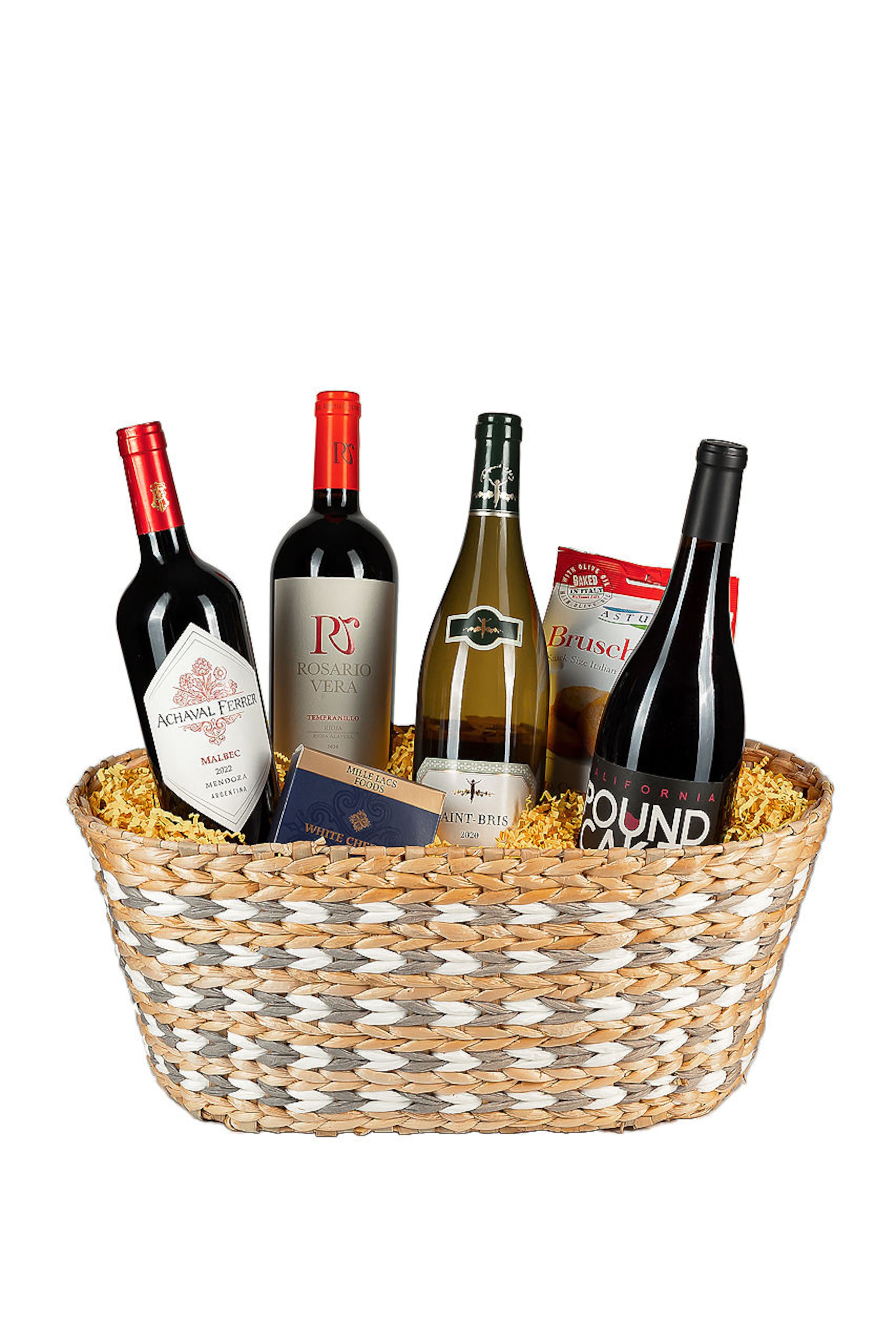 Canasta en mimbre con un surtido de vinos Pound Cake Pinot Noir, Rosario Vera, Achavar Ferrer Mendoza Malbec, Chablisienne Sauvignon Blanc y conservas.