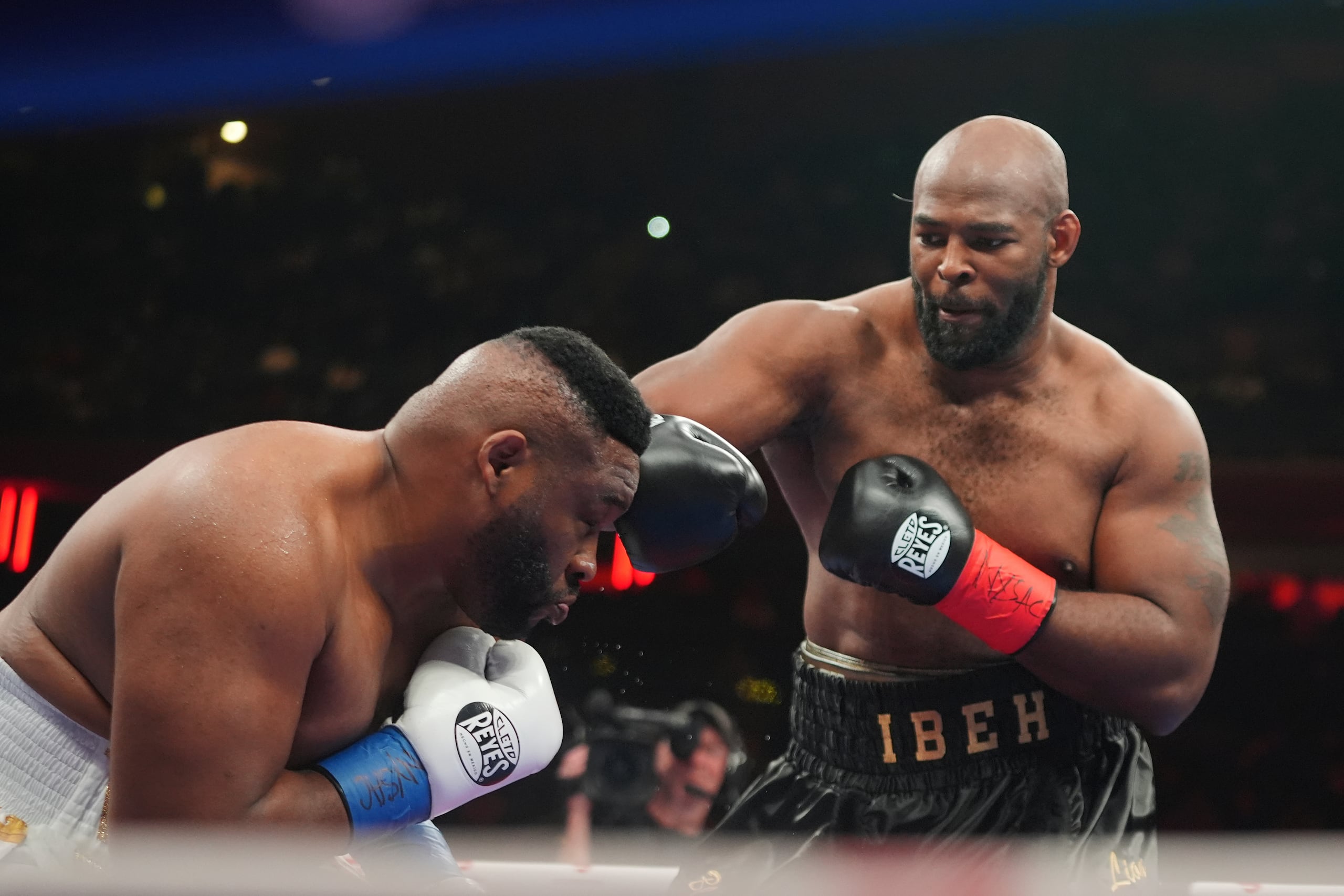 Kingsley Ibeh=, right, punches Jarrell Miller during a heavyweight boxing match Saturday, Jan. 31, 2026, in New York. (AP Photo/Frank Franklin II)