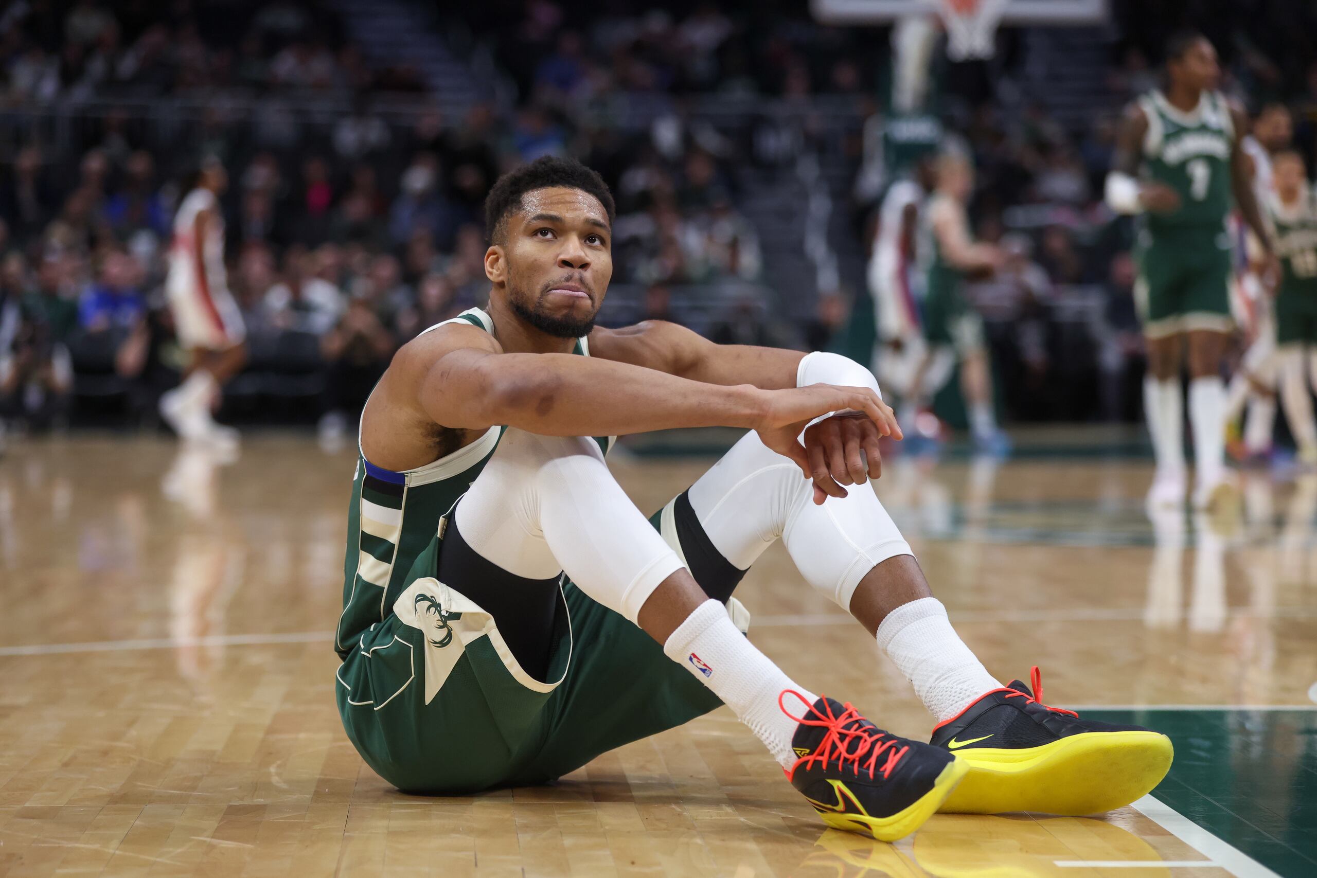 Milwaukee Bucks' Giannis Antetokounmpo reacts after suffering an injury during the first half an NBA basketball game against the Detroit Pistons, Wednesday, Dec. 3, 2025, in Milwaukee. (AP Photo/Kylie Bridenhagen)