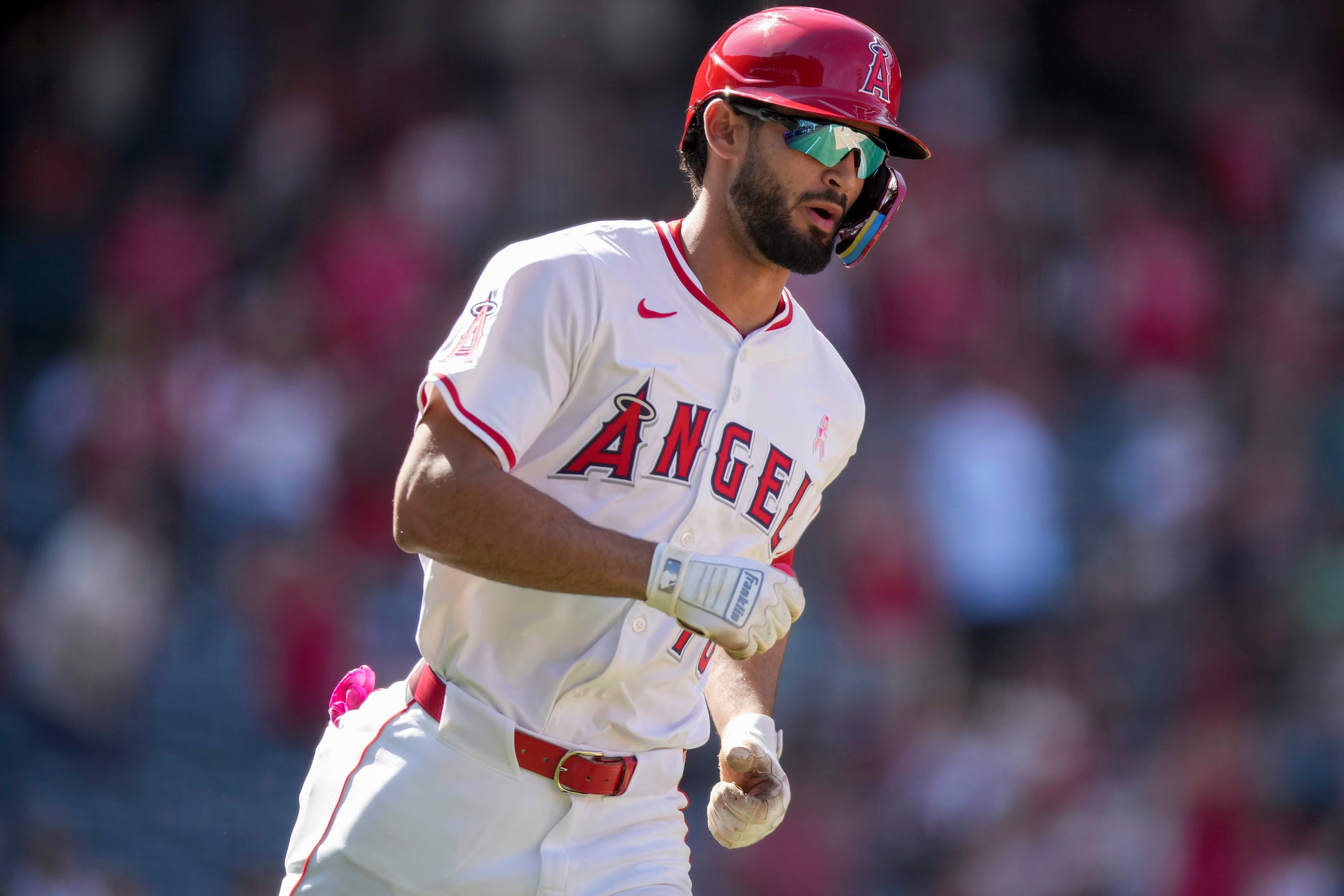 Los Angeles Angels' Matthew Lugo runs to first base after hitting a home run during the ninth inning of a baseball game against the Baltimore Orioles, Sunday, May 11, 2025, in Anaheim, Calif. (AP Photo/Eric Thayer)