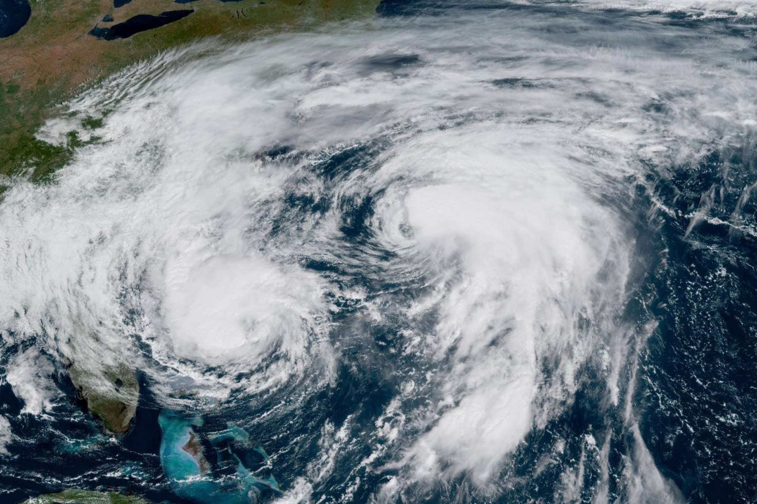 This GOES-19 GeoColor satellite image taken Tuesday, Sept. 30, 2025 and provided by NOAA, shows weather systems in the Atlantic Ocean, Hurricane Imelda, left, and Hurricane Humberto at right. (NOAA via AP)