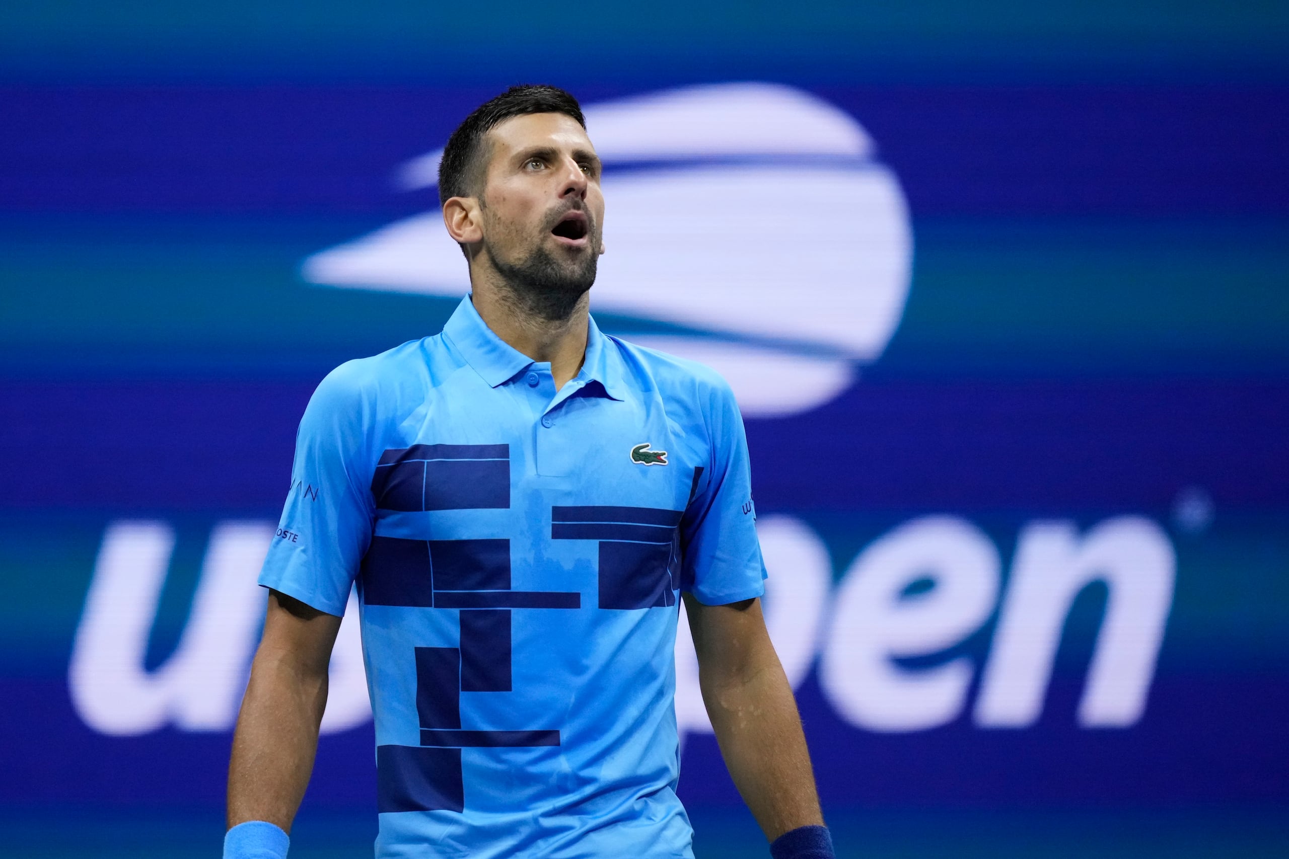 Novak Djokovic, of Serbia, reacts against Alexei Popyrin, of Australia, during a third round match of the U.S. Open tennis championships, Friday, Aug. 30, 2024, in New York. (AP Photo/Julia Nikhinson)
