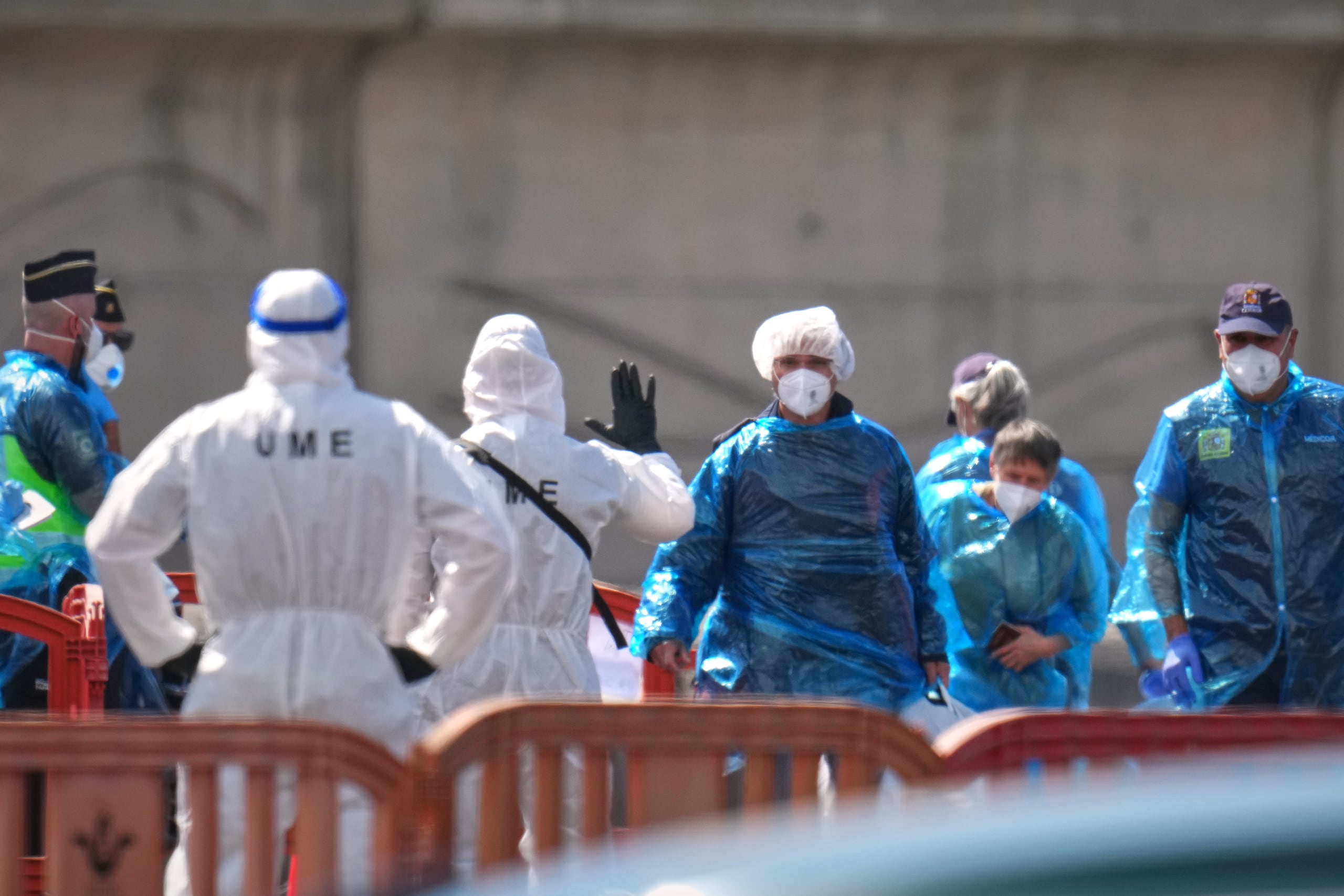 Passengers are disembarked from the hantavirus-stricken cruise ship MV Hondius at the port of Granadilla in Tenerife, Canary Islands, Spain, Sunday, May 10, 2026. (AP Photo/Manu Fernandez)