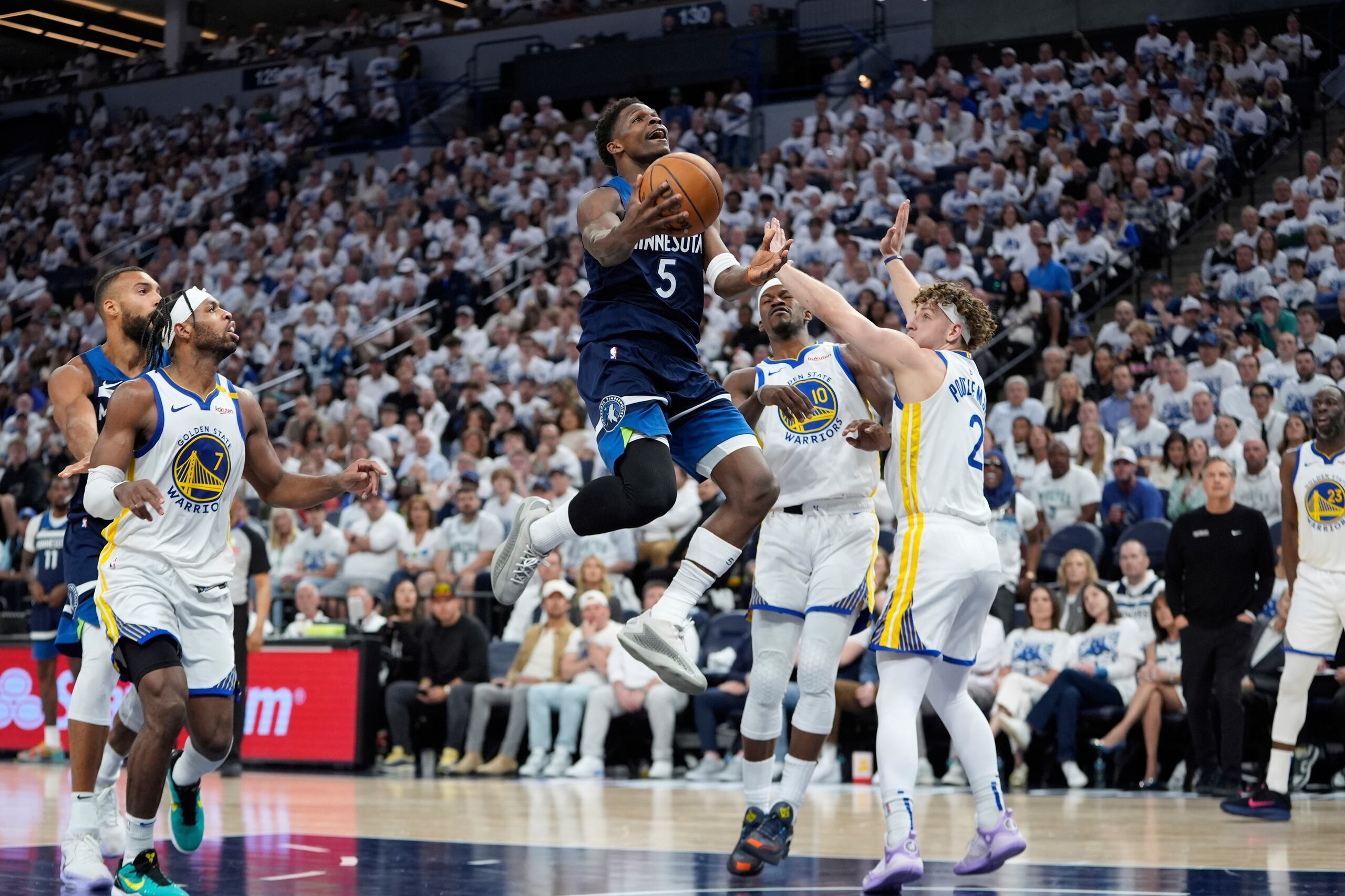 Minnesota Timberwolves guard Anthony Edwards (5) goes up for a shot during the second half of Game 2 of an NBA basketball second-round playoff series against the Golden State Warriors, Thursday, May 8, 2025, in Minneapolis. (AP Photo/Abbie Parr)
