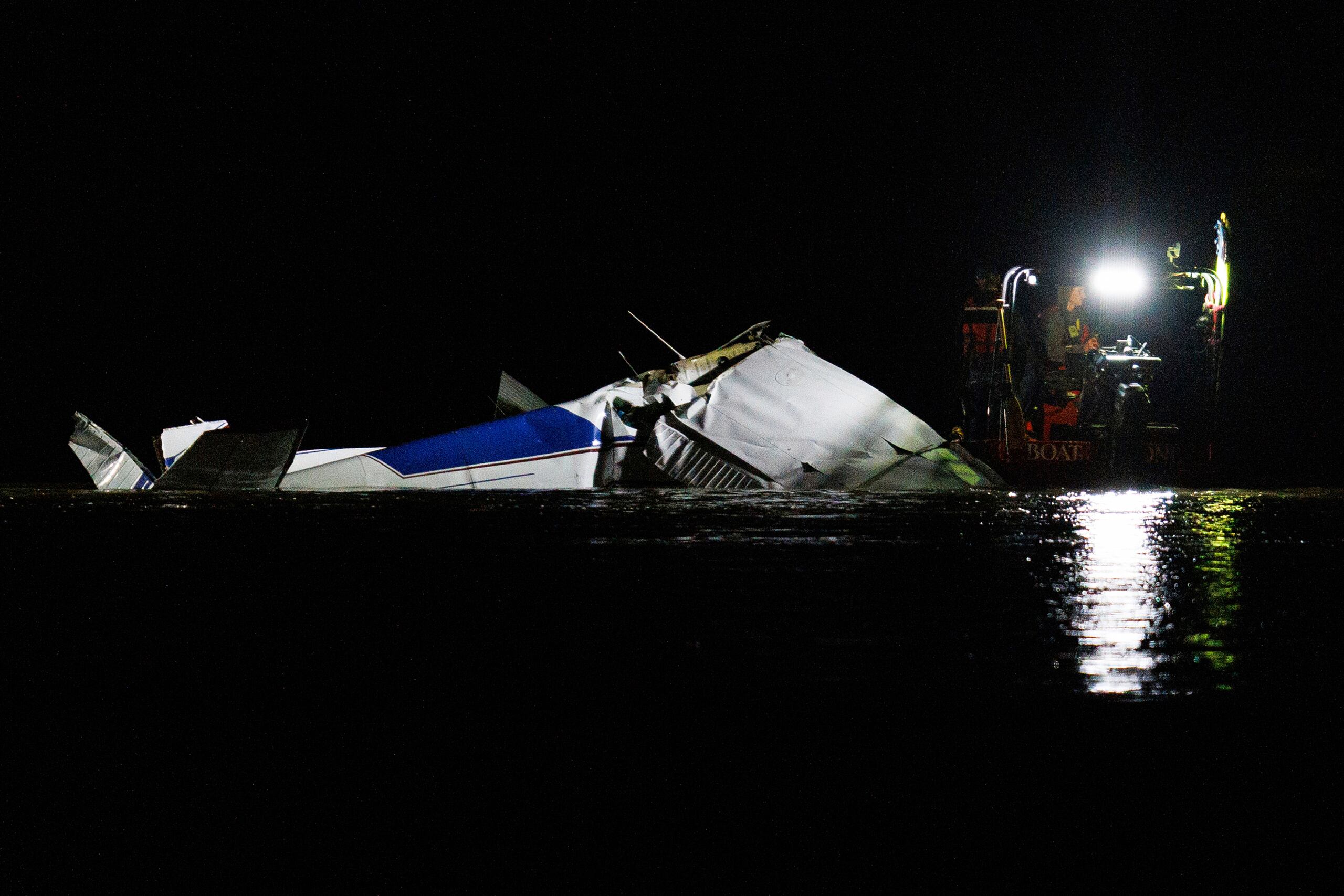 Emergency crews respond after a plane crashed into the Platte River killing several people Friday, April 18, 2025, in Fremont, Neb. (Nikos Frazier/Omaha World-Herald via AP)