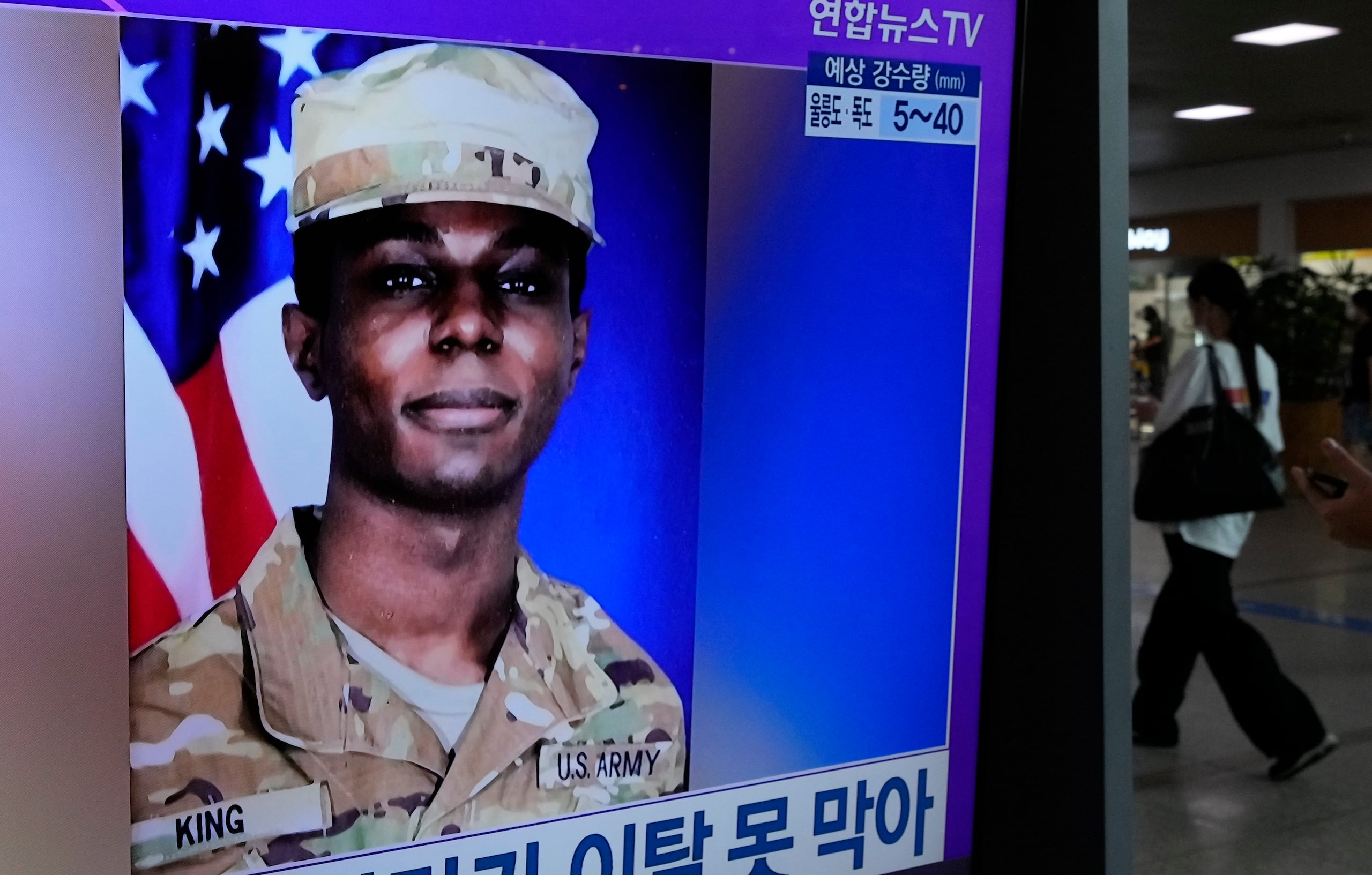 A TV screen shows a file image of American soldier Travis King during a news program at the Seoul Railway Station in Seoul, South Korea, Monday, July 24, 2023. The deputy commander of the U.N. Command said Monday it has started conversations with North Korea over King who ran into the North last week across the Koreas' heavily armed border. (AP Photo/Ahn Young-joon)