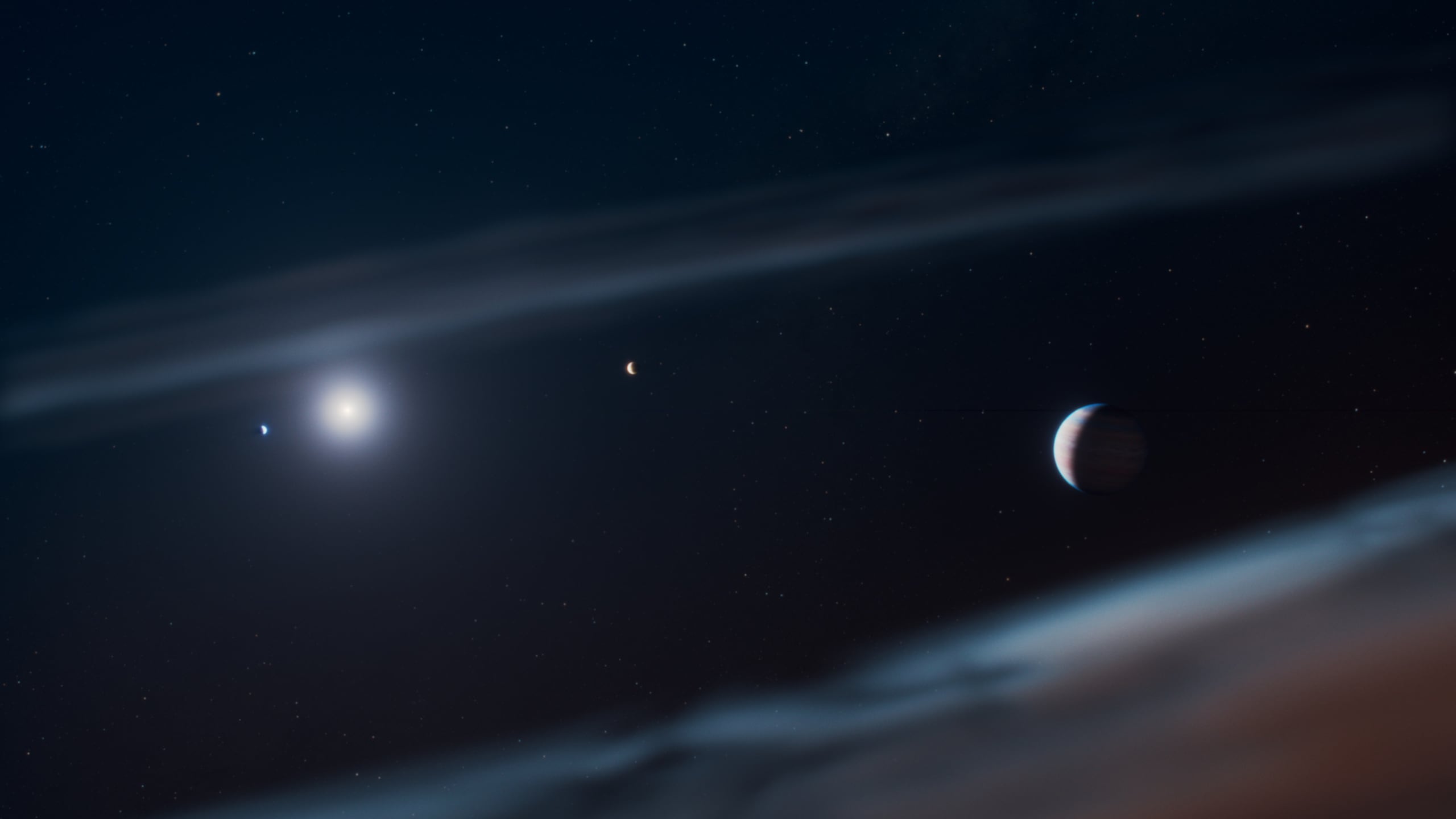 Concepto artístico del joven sistema planetario Beta Pictoris, con el recién descubierto exoplaneta gigante Beta Pictoris d a la derecha. Beta Pictoris c orbita más cerca de la estrella (a la izquierda en esta ilustración), Beta Pictoris b lo sigue en una órbita más amplia y el recién descubierto Beta Pictoris d se encuentra más alejado, justo en el borde interior del disco de escombros.