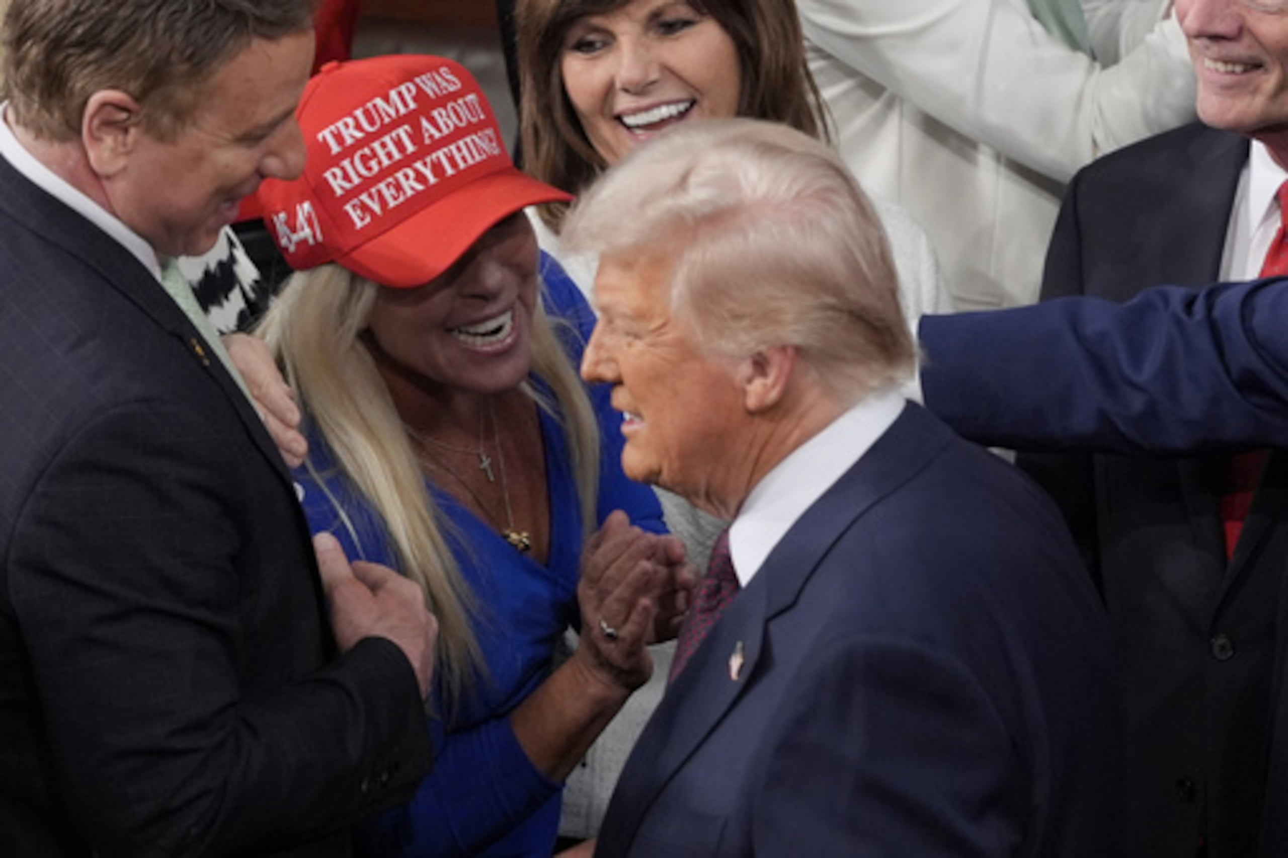 FILE - President Donald Trump arrives and walks by Rep. Marjorie Taylor Greene, R-Ga., to address a joint session of Congress at the Capitol in Washington, Tuesday, March 4, 2025. (AP Photo/J. Scott Applewhite, File)