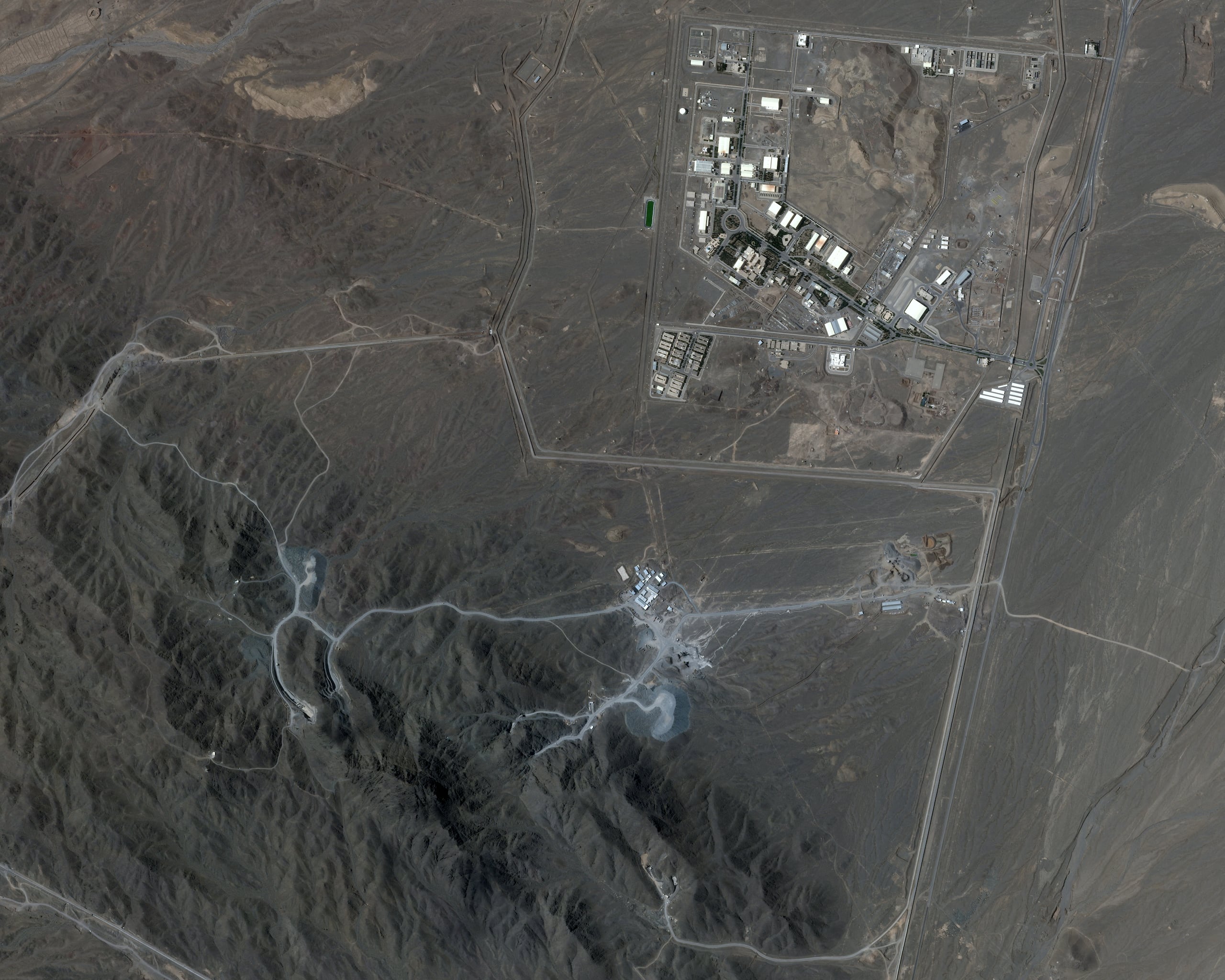 (FILES) This handout satellite image released by Planet Labs on June 13, 2025, shows the Natanz nuclear facilities (Shahid Ahmadi Roshan Nuclear Facilities), near Ahmadabad, Iran on May 20, 2025. President Donald Trump said June 21, 2025 the US military has carried out a "very successful attack" on three Iranian nuclear sites, including the underground uranium enrichment facility at Fordo. "We have completed our very successful attack on the three Nuclear sites in Iran, including Fordow, Natanz, and Esfahan," Trump said in a post on his Truth Social platform. (Photo by Handout / � 2025 PLANET LABS PBC / AFP) / RESTRICTED TO EDITORIAL USE - MANDATORY CREDIT "AFP PHOTO / SATELLITE IMAGE �2025 MAXAR TECHNOLOGIES " - NO MARKETING NO ADVERTISING CAMPAIGNS - DISTRIBUTED AS A SERVICE TO CLIENTS