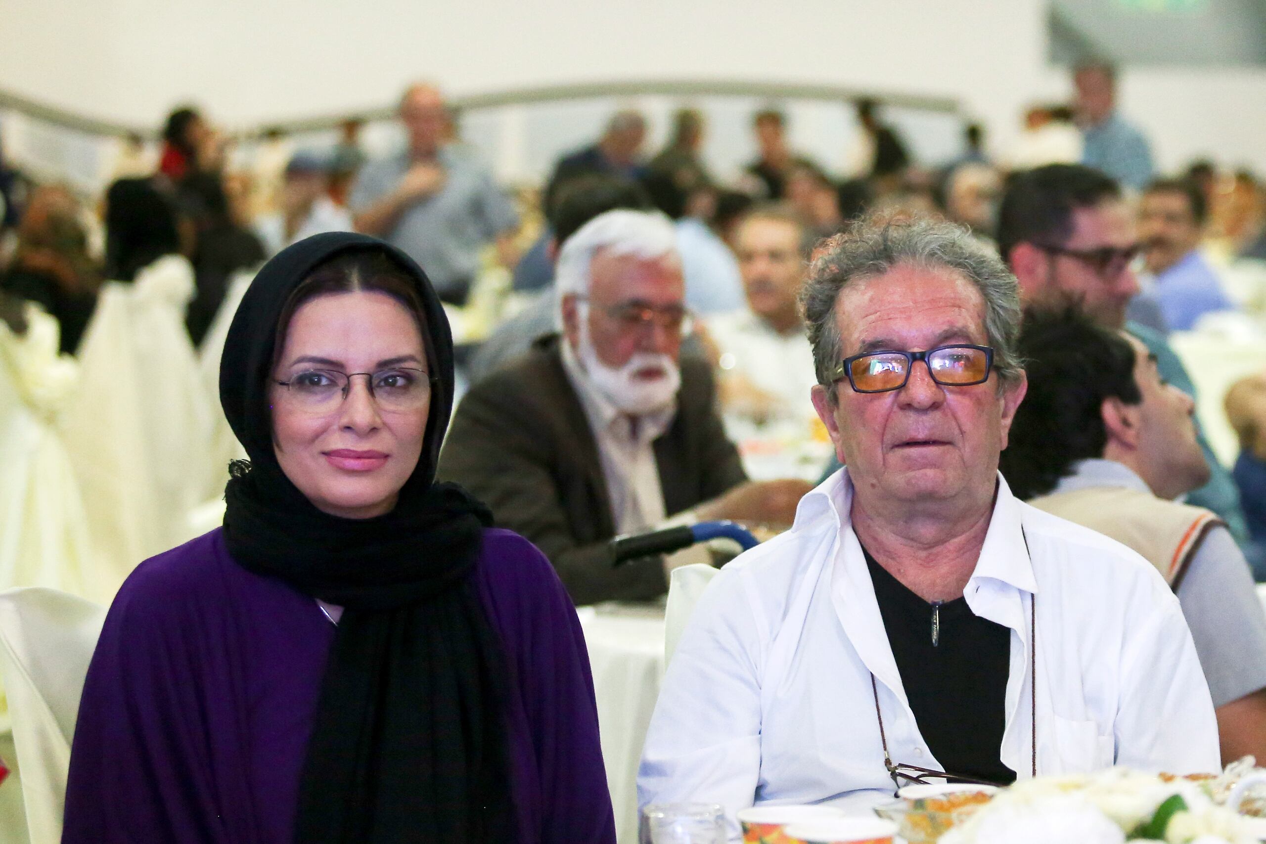 In this photo taken on July 7, 2015, and provided by the Iranian Students' News Agency, ISNA, Iranian film director Dariush Mehrjui and his wife Vahideh Mohammadifar attend a film directors' meeting in Tehran, Iran. Noted Iranian film director Dariush Mehrjui and his wife were stabbed to death in their home by an unknown assailant, state media reported Sunday, Oct. 15, 2023. (Abdolvahed Mirzazadeh, ISNA via AP)