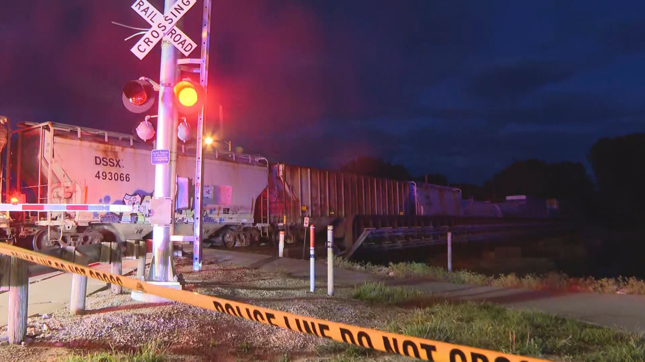 In this image made from video, a train sits idle on tracks after striking multiple pedestrians Sunday evening, May 18, 2025, in Fremont, Ohio. (WTVG/13 Action News via AP)