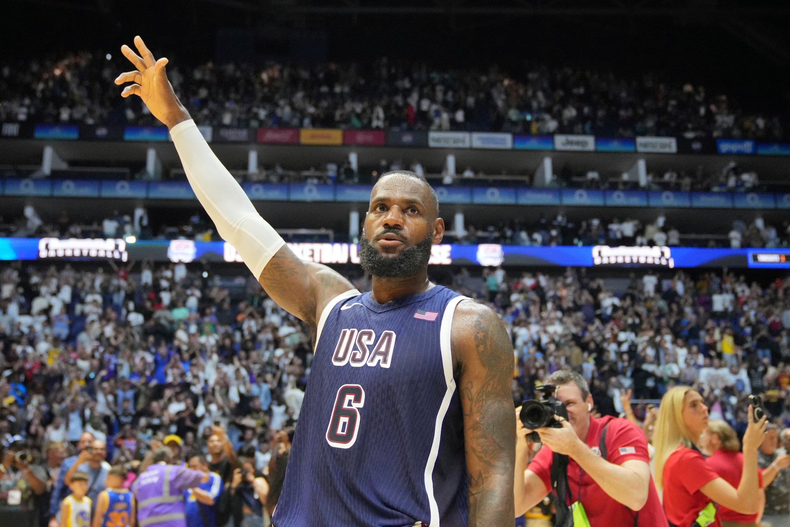 United States' forward LeBron James waves to the crowd after the end of an exhibition basketball game between the United States and South Sudan, at the o2 Arena in London, Saturday, July 20, 2024. (AP Photo/Kin Cheung)