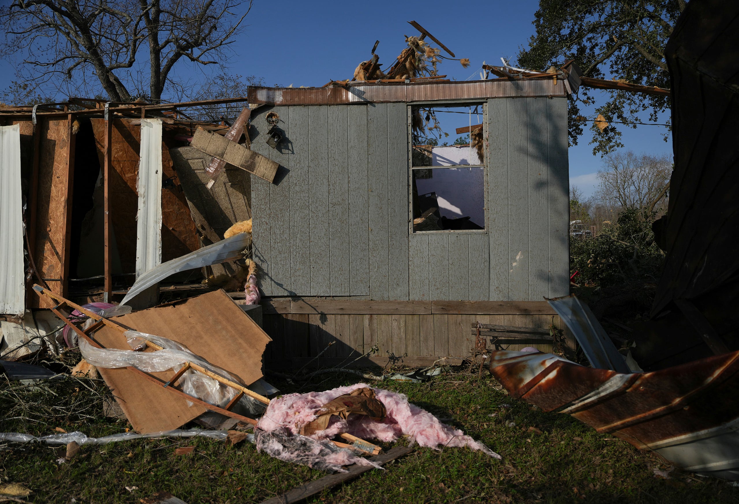 A mobile home sits damaged following a tornado that went through Katy, Texas, Saturday, Dec. 28, 2024. (Elizabeth Conley/Houston Chronicle via AP)