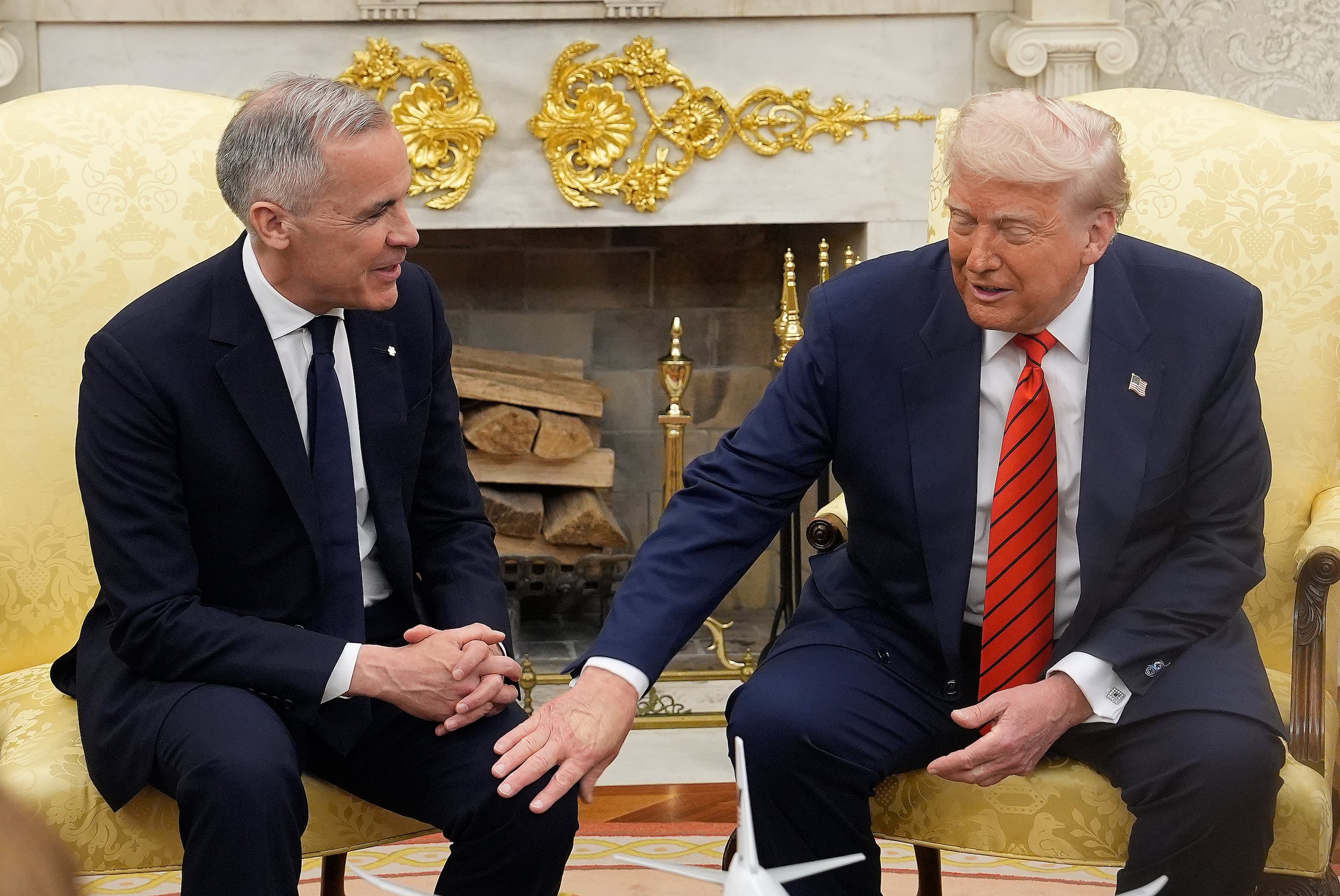 Canada Prime Minister Mark Carney and U.S. President Donald Trump engage in a meeting at the White House in Washington, Tuesday, May 6, 2025. (Adrian Wyld/The Canadian Press via AP)