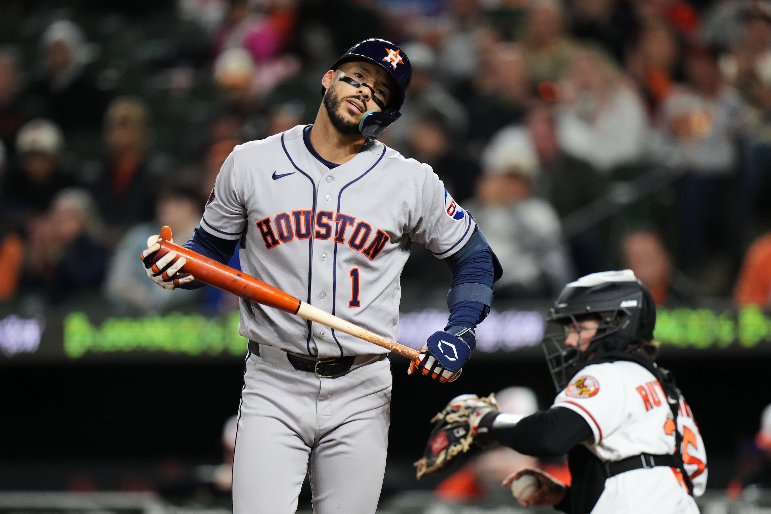 Houston Astros' Carlos Correa (1) reacts after striking out during the seventh inning of a baseball game against the Baltimore Orioles, Tuesday, April 28, 2026, in Baltimore. (AP Photo/Stephanie Scarbrough)