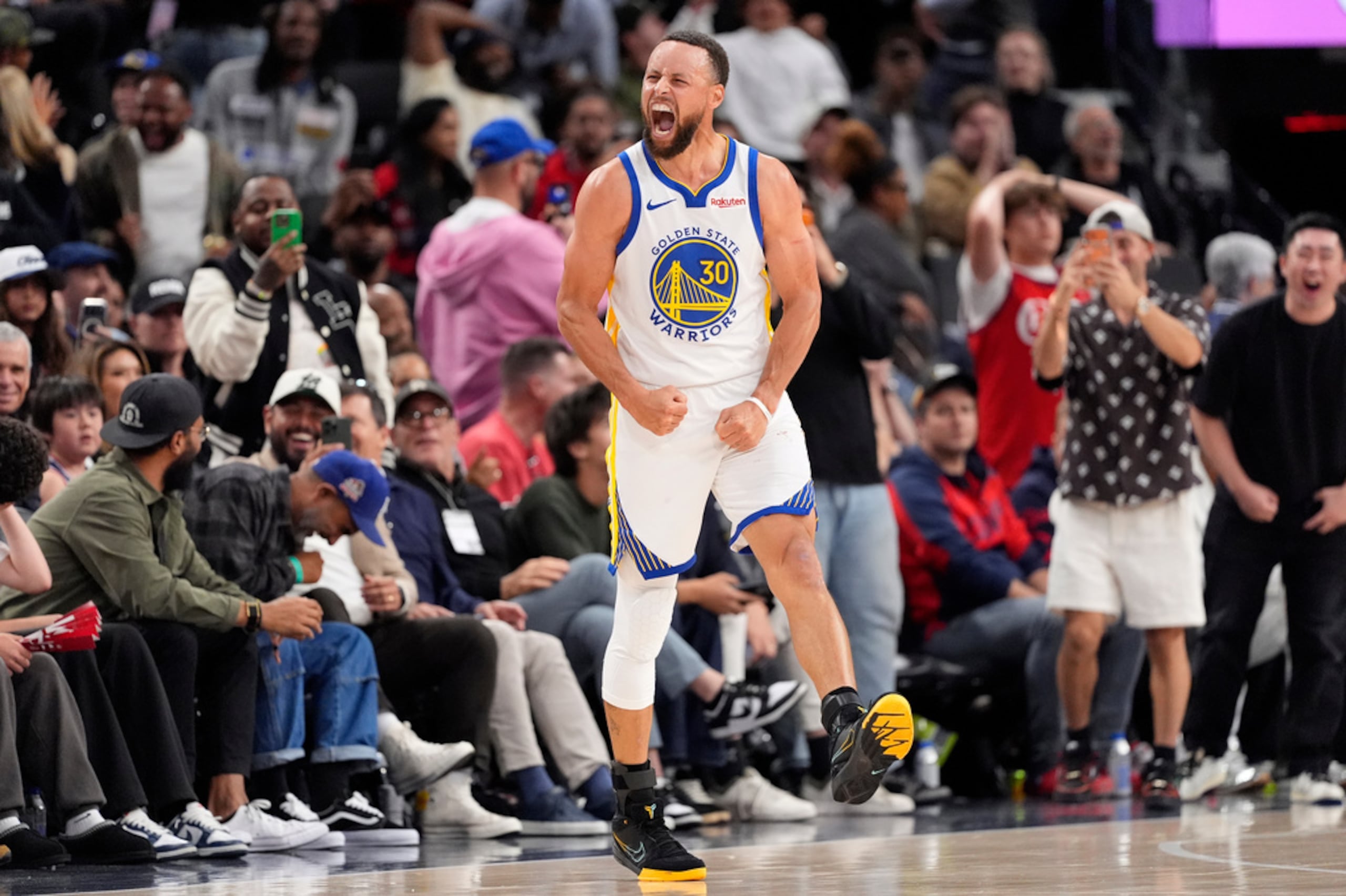 Golden State Warriors guard Stephen Curry celebrates after scoring during the second half of an NBA play-in tournament basketball game against the against the Los Angeles Clippers, Wednesday, April 15, 2026, in Inglewood, Calif. (AP Photo/Mark J. Terrill)